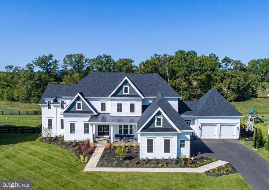 🌟 TRULY SPECTACULAR! 🌟 This fully expanded and meticulously upgraded Clifton Park II model by NV Homes is extraordinary! With over 9,000 square feet of unmatched luxury and sophisticated design, this home is crafted to complement and elevate your lifestyle.
🏡 The Heart of the Home
Step into the expansive kitchen—a chef's dream! With double kitchen islands, a cooktop with an in-wall faucet for pasta pots, and top-of-the-line GE Café professional appliances, this kitchen is built for family gatherings and unforgettable meals. A Sub-Zero built-in refrigerator takes it to the next level, making this space the hub of the home where everyone wants to be.
🌟 A Living Space That Inspires
The family room is a showstopper, with soaring windows that frame stunning views of the flat backyard, backed by the serene beauty of the Conservancy Willowsford property. The coffered trim ceiling and brick accent walls add a touch of timeless charm, while the bonus room above the family room is an ideal spot for remote learning or a creative studio.
💼 Work and Live in Style
The home office is tailor-made for telecommuters, offering a peaceful, productive environment. Need extra space? The main-level second master bedroom is a dream come true for multi-generational living or hosting visiting family and friends.
🛁 Owner's Retreat
The primary owner’s suite is pure indulgence! Hardwood floors, an exquisite spa bath with a stand-alone soaking tub, a two-person shower with dual heads, and upgraded vanities make this your sanctuary. Every bedroom in this home features a private ensuite bathroom and walk-in closet for unparalleled comfort.
🎉 Entertainment and More
The lower level is an entertainer's paradise, with a spacious wet bar, an open recreation area, and a home theater perfect for movie nights. A home gym, sixth bedroom, and fifth full bath complete the space—plus an additional powder room for your guests' convenience.
🚗 So Much Space!
A rare 5-car garage design, a fully fenced rear yard, and an in-ground irrigation system ensure this home is as practical as gorgeous.
📢 Don’t wait to make this dream home yours!  This is not just a house—it’s the perfect place to call home!
This home is located in the award-winning Willowsford Community, framed by the natural splendor of Loudoun's wine country. The resort-style amenities include community events, outdoor beach-entry swimming pools, a splash pad, a lodge, a fitness center, a lake, dog parks, tot lots, a sledding hill, and even a tree house! Don't miss the neighborhood farm stand/CSA.