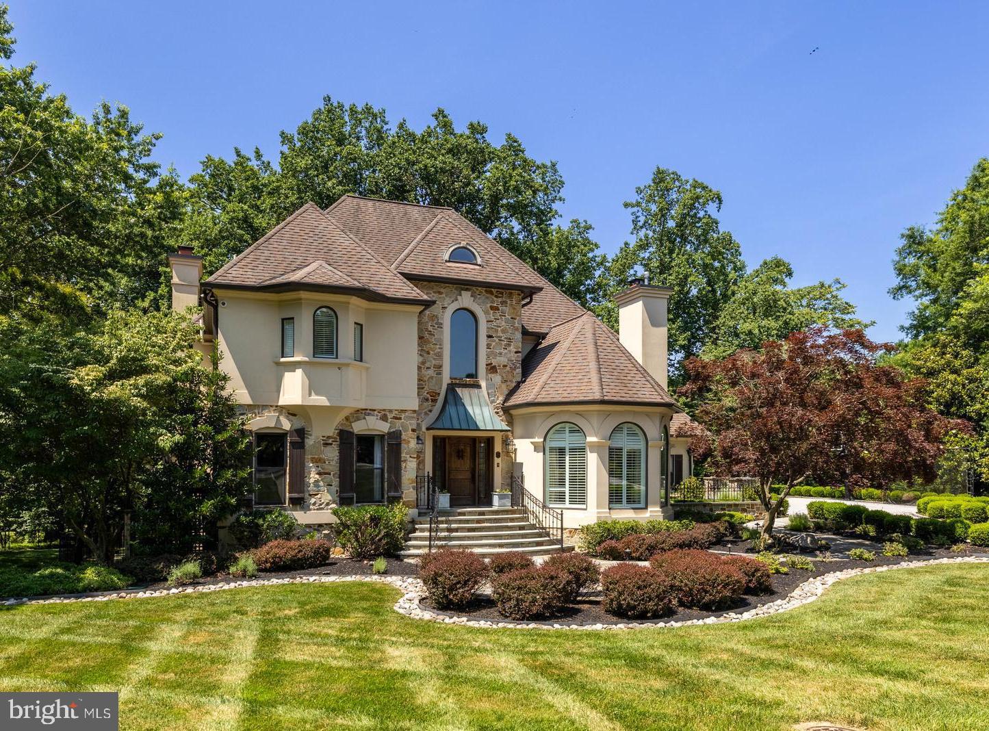 The look and feel of a new home! Built in 1990 but thoroughly renovated and updated by an interior designer with many fine features, finishes and modern amenities yet with a classic vibe. The vaulted Foyer welcomes guests with gleaming porcelain flooring and beautiful staircase. Modern French doors lead to a an office with coffered ceiling and built-ins. Vaulted Living Room with bay window and gas fireplace in porcelain tiled chimney wall flows to the formal Dining Room with French doors to a walled garden. The gourmet Kitchen with white Shaker cabinets, quartz counters, Viking appliances and large breakfast area flows to the Family room with coffered ceiling, gas fireplace and surround sound. French doors lead to a stunning elevated covered porch with a Wolf gas grill cooking center, retractable screens and ceiling mount heaters. Porcelain tiled Powder Room, custom fitted Laundry Room and 3-car Garage complete the main level. A sumptuous vaulted Primary Bedroom with fireplace and luxurious vaulted spa Bath shares the upper level with 3 additional Bedrooms, 2 Baths and a Study with custom built-ins, access to the Sun Deck and library ladder to a Loft. The walk-out lower level includes a Rec Room with fireplace, surround sound, French doors to patio and wet bar. A glass wall with sliding doors to an Exercise Room, Bedroom 5 and full Bath. The Utility Room is fitted out with state-of-the-art systems. Outdoor venues include a fenced back yard with firepit and dog run, lower level covered patio, main level covered porch and upper level sun deck. Perfect for large scale entertaining or intimate family gatherings- inside and out.
