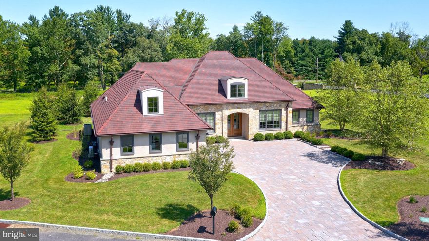 Welcome to 2747 Avenue Du Village. This French Provincial estate with modern aesthetics is situated on prime, manicured grounds in the heart of Saucon Valley. Open the french doors and you are immediately greeted by the spacious open floor plan. To your right, glass french doors lead to the office with tray ceilings. Across from the office is the living room with cathedral ceilings and an oversized window. The main living area rounds out with a gas fireplace surrounded by floor to ceiling shiplap. From the fireplace area you can see the spectacular white kitchen, with Quartz Countertops, Custom Cabinetry and Thermador appliances. Next to the kitchen is a breakfast area, perfect for your morning coffee. The Primary Bedroom is on the first floor with radiant heat hardwood flooring, a linear gas fireplace, two walk-in closets and an en-suite bathroom. The first floor also has two more bedrooms connected by a Jack & Jill bath. Upstairs you will find an additional full bath and bedroom.