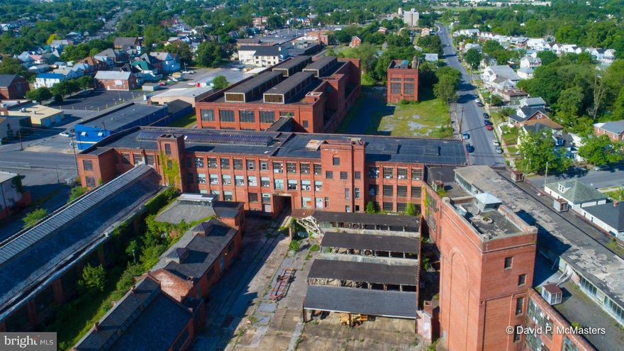 The Interwoven Mill Complex 4 blocks from center of Martinsburg; 8 from I-81. 13 buildings, 300,000+ SF under roof, served by 3 streets/ a RR spur. 3 buildings rehabbed/ 2 rented antiques/flea market, 1 former tavern. Creativity needed for rest. Great storage potential, maybe government purchase. Several previous plans, concepts available. GREAT LOCATION. See attachments.  High speed internet available and in use.   THIS IS A QUALIFIED  OPPORTUNITY ZONE PROPERTY. Possible historic rehab tax credits, other local/state help. Possible residential conversions.  Top floors have nice views to the Blue Ridge  mountains.     The City of Martinsburg will be very co-operative with any reasonable plan.