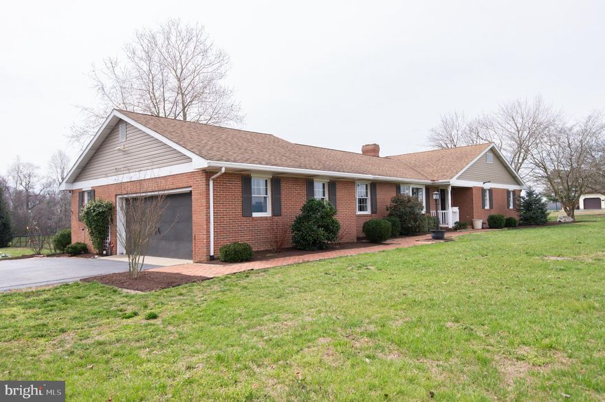 Welcome to this truly exceptional brick rancher! Situated on a spacious 3.62-acre lot, this immaculate home offers four bedrooms and 3 1/2 baths, providing ample space for comfortable living. The fenced-in backyard, mature landscaping, and brick walkways add to the charm and beauty of the property.

As you step inside, you'll be greeted by an inviting foyer that leads to a large kitchen designed for culinary enthusiasts. The kitchen features double ovens, a gas cooktop, stainless steel appliances, solid surface countertops, and a stunning tile backsplash. With a peninsula and a dining area finished with shiplap and an oversized bay window, this space is perfect for enjoying meals and creating lasting memories.

Adjacent to the kitchen is a separate dining room that flows into a formal living room area, adorned with exquisite hardwood floors throughout. The inviting family room, just off the foyer, offers custom built-in cabinetry with reclaimed wood doors, a gas fireplace, and an elegant mantle. The oversized patio doors lead to a deck, allowing natural light to fill the space. Thoughtful pocket doors provide the option to create privacy when desired.

The private hallway leads to two guest bedrooms and a full bath with newly installed cabinetry and solid tops. At the end of the hallway, you'll find the private owner's suite, offering ample storage with a spacious walk-in closet. The updated owner's full bath features a large walk-in shower with a stylish glass enclosure and shiplap accents.

One of the highlights of this home is the desirable mudroom, located just off the attached 2-car garage. This space includes a washer, dryer, utility sink, and is the perfect place to kick off your shoes. Adjacent to the mudroom is a charming powder room with shiplap walls and oversized reclaimed wood floors.

Through a barn door in the mudroom, you'll discover the expansive fully-finished basement. This area offers a large entertainment/living room space with a kitchenette and a full bath, making it ideal for an in-law suite or a "man cave". But the basement doesn't stop there! It also features a separate workshop, a dedicated built-in storage area, and a craft/scrapbooking space with an island and cabinetry.

Storage is abundant in this home, with a finished 2-car attached garage, a 2-car detached garage, two sheds, dedicated RV and boat parking, and a paved circular driveway. The patio area, complete with maintenance-free decking, is the perfect spot for entertaining, with a hot tub and piped-in gas for grilling.

This home has been thoughtfully updated with new features, including a tankless gas water heater, air filtration system, water filtration system, HVAC systems, and a Humidistat. Custom trim work, shiplap accents, custom built-in cabinetry, reclaimed wood, hardwood flooring, and expansive lighting fixtures add to the attention to detail throughout the home.

Don't miss out on the opportunity to see this remarkable property in person. Schedule a viewing today and prepare to be impressed by its beauty and functionality!