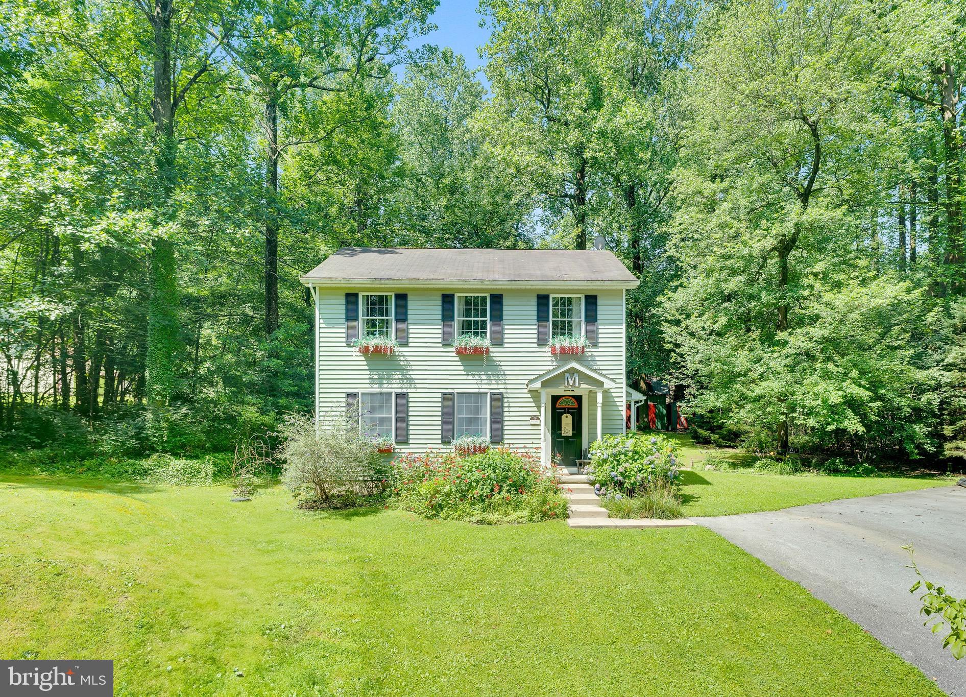 Looking for privacy but also close to all amenities then don't miss your opportunity on this beautiful 3 bedroom colonial on a private 1.2 acres with tons of potential. As you walk into this charming home you have a spacious living room, private dining room, and eat in kitchen with an island for entertaining. Off of the dining room is the maintenance free decking with a portion of the yard fenced in. Downstairs offers more entertaining space with 2 separate bonus rooms and an additional family room. Completing the lower level is the private laundry room. Upstairs are 2 spacious bedrooms, Full bathroom, and a primary bedroom with a walk in closet containing built ins. Back outside on the 1.2 acres there are endless possibilities with a pond, 2 large sheds, and plenty of space to expand. Can't beat the location: 1 mile from Saint Peters Village, Close to all shopping and amenities, Public pond access within walking distance of the home, Coventry Wood Park and access trails all around. Hot water heater replaced in 2023. House is being sold AS IS.