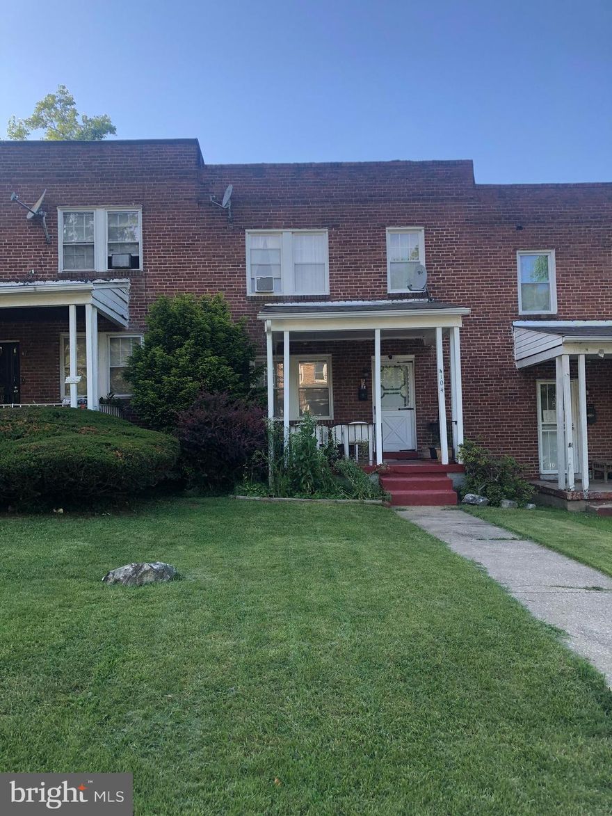 All Brick, three bedrooms and 2 bathrooms Interior Townhouse located on the Tree Lined quiet section of  Woodhaven Avenue.  Walk right through well cared for front yard on the walkway , onto the Front Porch and into the house. It comes with Hardwood Floors on the Main and Upper Levels, covered by wall to wall carpet.   From  the kitchen  on the Lower Level, you can walk right into the kitchen with groceries  after parking in the rear paved Parking Pad that holds four cars, easily. Seller is moving things, so more photos will be added.  The house is sold "AS IS".