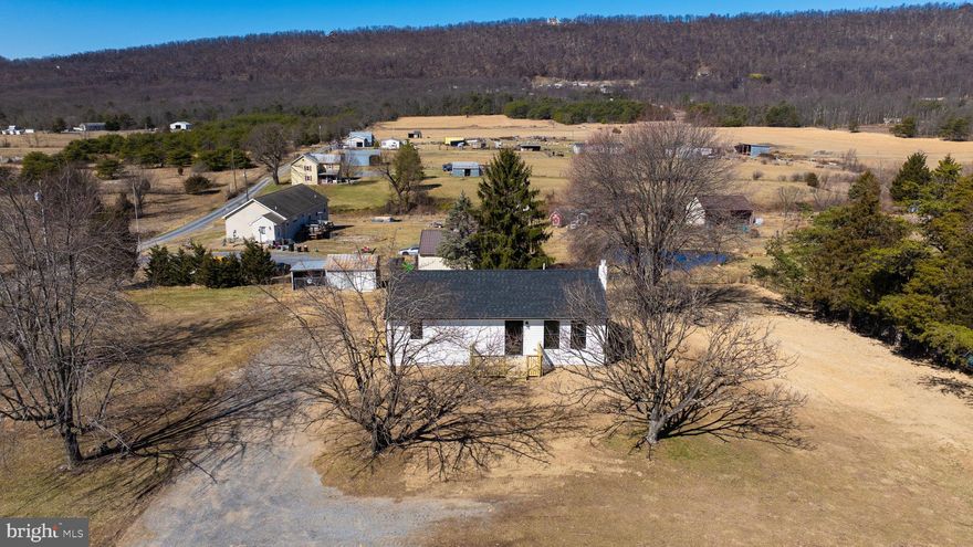 Discover this beautifully remodeled  2-bedroom, 2-bathroom ranch-style home nestled on a picturesque 1-acre lot with stunning pastoral and mountain views. Located in a highly sought-after area, this home offers one-level living with an unfinished walk-out basement for endless possibilities. This home has been thoughtfully remodeled  - NEW HVAC system, NEW roof,  NEW appliances, kitchen sink, cabinets, tubs, showers, vanities,  drywall, windows, flooring, vinyl siding, and a spacious new deck—plus so much more! Every detail has been carefully chosen to enhance both style and functionality, creating a fresh and modern living space. peaceful country living with no HOA restrictions while still being close to modern conveniences. Relax on the front deck and take in the scenic surroundings. Stay tuned for more information!