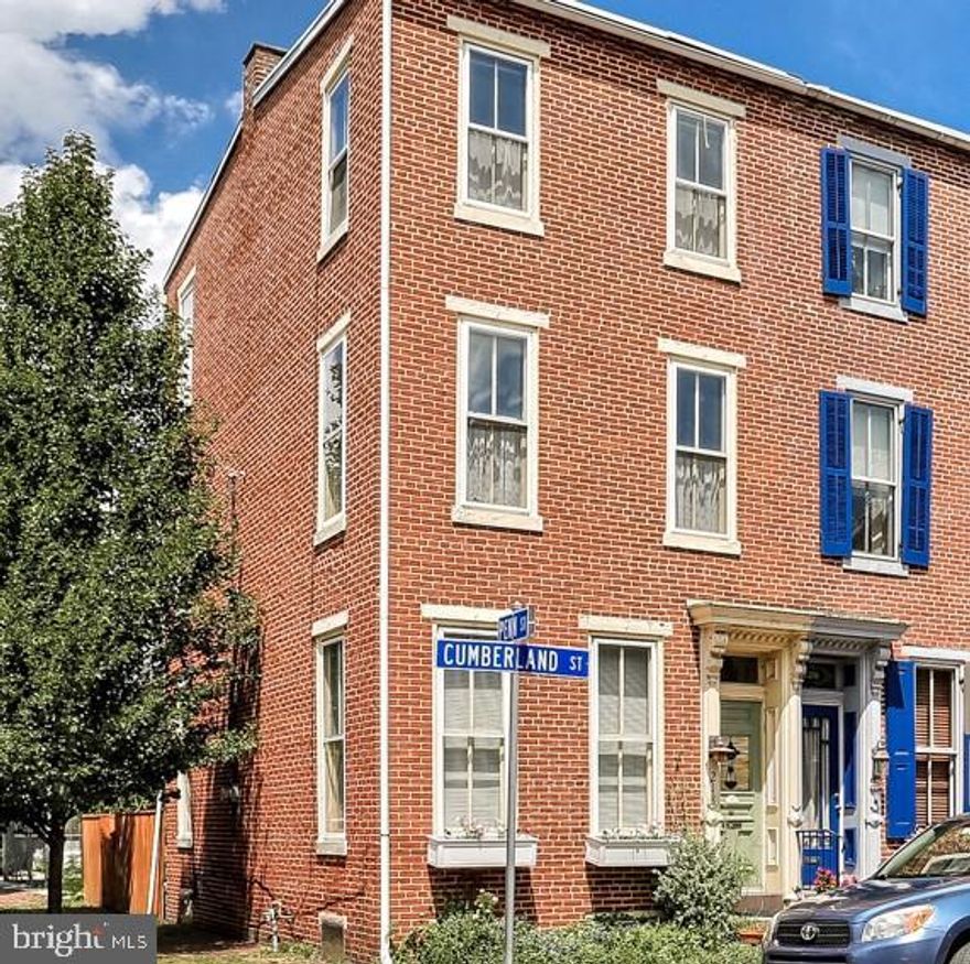Delightful brick end-of-row townhome tucked in the heart of popular Historic Midtown just a few blocks to Riverfront Park, Broad Street Market, new Millworks Galleries and dining, Midtown Cinema and Capitol Complex! Bright SW exposure enhances large rooms with lots of windows, wood floors, deep baseboards and trim. Second floor den and laundry. Side balcony/porch overlooks fenced courtyard. All appliances remain. Efficient gas heat, central air. Move right in! Not in the flood plain.