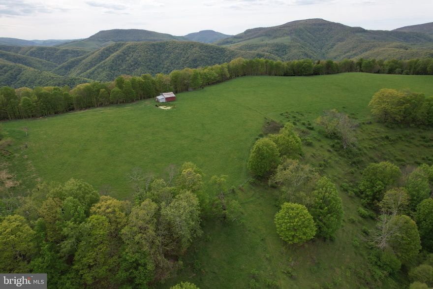 🏞️ 187 Acres Bordering National Forest – A Rare Opportunity in Wild & Wonderful West Virginia!

This stunning 187-acre property—comprised of two parcels (107 acres + 80 acres)—offers an unbeatable mix of open farmland, lush woods, and breathtaking mountain views. A true gem for hunters, homesteaders, or investors alike!

Located in close proximity to Seneca Rocks, this land stretches all the way to the top of the mountain, with select spots offering a direct view of the iconic rock formation. Approximately 50% to 70% of the property borders national forest, creating a rare opportunity for privacy, recreation, and endless exploration.

Property features include:

A large upper field ideal for farming or pasture, completely fenced and accompanied by a barn

An artesian well producing abundant water—enough to potentially supply multiple homes

Two spring-fed ponds perfect for wildlife, livestock, or relaxation

Rolling woodlands, ridges, and natural beauty throughout

Ideal terrain for hunting, hiking, riding ATVs, or future building sites

Whether you're dreaming of a private mountain retreat, a working farm, a recreational paradise, or a legacy investment, this land has the space, water, and freedom to make it happen.

Opportunities like this—especially with this much national forest frontage—rarely come available.