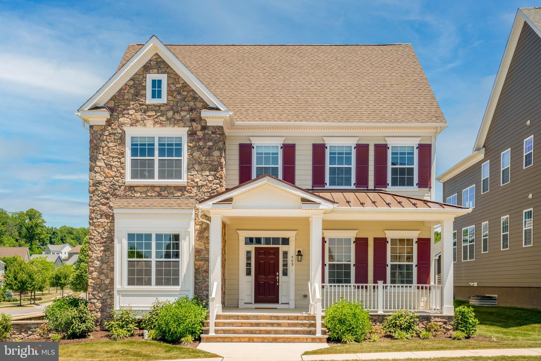 Welcome to this exquisite luxury home located in the prestigious Spring Oak community. This 2-story Colonial was completed in 2021 with elegance and style. Situated on a desirable corner lot, this home offers a picturesque view of the community park across the street. As you arrive, you'll be captivated by the inviting curb appeal, with stone steps leading to a covered front porch, and meticulously maintained landscaping. Entering into the grand 2-story foyer, adorned with hardwood floors, a curved staircase, recessed lighting, crown molding, and 9 ft ceilings, a touch of sophistication stretches to every corner. To the left of the foyer, an expansive office with large windows and glass-paneled French doors, creates an ideal space for productivity. Down the hall, a 1st floor bedroom can also serve as an additional office, providing flexibility to suit your needs. To the right of the entry, a formal dining room awaits with a chandelier, crown molding, and wainscoting, setting the stage for memorable gatherings. Proceeding down the hall, a convenient hall closet leads you to the heart of the home—the open concept main living space. The magnificent 2-story family room features a cozy gas fireplace, chandelier, and abundant tall windows that fill the room with natural light. This inviting space seamlessly flows into the gourmet kitchen and dining area, perfect for both casual family meals and entertaining guests. The gourmet kitchen is a chef's dream, boasting an oversized island with a sink and ample seating for 3 barstools. Adorned with white cabinets, upgraded granite countertops, and stainless steel appliances, including a double wall oven and gas cooking range, this kitchen combines functionality and elegance. Additional highlights include under cabinet lighting, a walk-in pantry, and a dry bar with cabinets for effortless entertaining. The adjacent eating area with sliding doors provides easy access to outdoor enjoyment. Convenience meets luxury on the 1st floor, with a dedicated laundry room that leads to the extended 2-car attached garage, with a bonus storage space. A half bathroom completes the 1st floor. Take the carpeted stairs to the second floor, where an expanded landing and hallway with hardwood floors welcome you. To the left, you'll find the primary bedroom suite, boasting crown molding, ample windows and a short hallway leading to two walk-in closets, providing abundant storage space. The upgraded primary bathroom is a spa-like retreat, featuring two separate vanity sinks, a makeup vanity, a frameless glass shower stall, and a private toilet area. Down the hall, you'll discover 2 large storage hallway closets and three additional well-appointed bedrooms, each adorned with plush carpeting. Bedrooms 3 and 4 share a jack and Jill bathroom with beautiful upgraded tile floors, separate double vanities, and a tub shower. Bedroom 4 also boasts a convenient walk-in closet. Bedroom 5 impresses with its own walk-in closet and a private princess bathroom, showcasing the same decorative tile floors as the Jack and Jill bathroom. This remarkable home offers a partially finished basement with faux wood vinyl floors, providing a versatile space for recreation or relaxation. Storage closets and a built-in entertainment center add functionality and style to this lower level. The basement also features a huge heated storage area, housing a high-efficiency tankless water heater. Additionally, the plumbing is roughed in for a future bathroom, allowing for further customization and convenience. Residents of Spring Oak will also enjoy an in-ground community pool for summertime enjoyment. Ideally situated, this home is just minutes away from the prestigious Chester Valley Golf Club, offering an exceptional golfing experience, as well as convenient access to the turnpike for effortless commuting. Don't miss the opportunity to make this luxury home your own and experience the epitome of refined living. Schedule your showing today!
