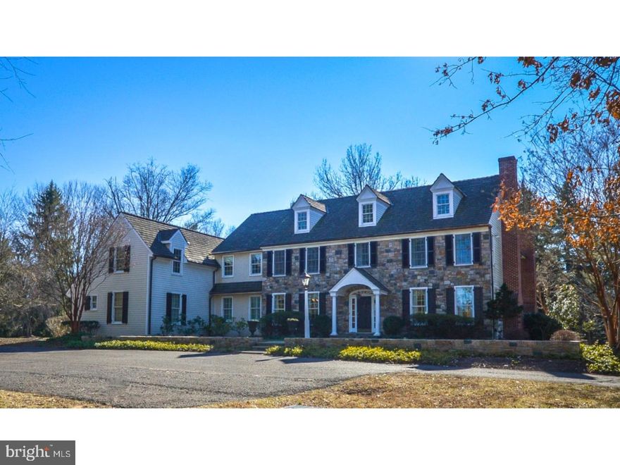 Spectacular custom stone colonial on almost 3 acres in Blue Bell.  Over 5500 square feet of living space, featuring 5 Bedrooms and 3.2 Baths.  A wonderful open floor plan is ideal for entertaining as well as family living with hardwood floors, custom crown molding, chair rails and wainscoting throughout the first floor.  Lovely Center Hall with sweeping staircase opens to formal Living and Dining Rooms.  The large Living Room features a fireplace and leads to a formal Powder Room with custom vanity and cozy Study with fireplace and French doors to the flagstone patio.  The formal Dining Room opens to a Butler's Pantry with cherry cabinets, granite counter top, bar sink and ice maker.  The fabulous Gourmet Kitchen featuring custom Kountry Kraft cabinets, large center island, granite counter tops and stainless steel appliances opens to a sunny Breakfast Room overlooking the backyard, and step down Family Room with built-in cabinetry, fireplace and coffered ceiling.  A mudroom with window seat, cubbies, second Powder Room and back stairs complete the first floor. The second floor includes a spacious Master Suite, Sitting Room with fireplace and French doors, his and her walk-in closets and spa-like marble Master Bath with jetted tub, large shower, vanity with dual sinks and make-up area.  There are three additional Bedrooms with walk-in closets, Jack and Jill Bathroom, Hall Bath and large fifth Bedroom/Playroom with adjacent Laundry Room. A flagstone patio with built-in gas grill can be accessed through the study, center hall and breakfast room, and overlooks a lovely wooded lot.  Freshly painted throughout , new carpet on the second floor, central vacuum system.  An enormous unfinished basement with 9 ft ceilings offers infinite possibilities for additional living and entertaining space.  Three car garage.  One Year Home Warranty.