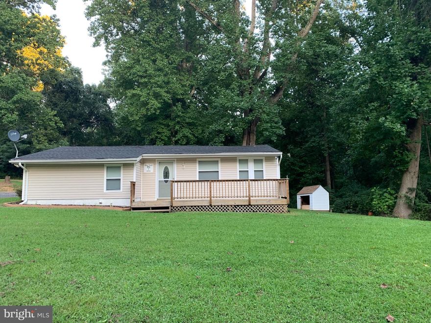 Bring your best offer for this cozy 2 Bedroom 1 bath rambler in the water privileged community of Eagle Harbor . The water view home is nestled on a corner lot and is mostly surrounded by trees for privacy. The home shows like new with the updated kitchen and bath, new carpet, new flooring, and fresh paint, which makes it move in ready. See uploaded documents to view the plat which shows the surrounding lots which convey with the home. Enjoy gardening in your rear yard,  or  fishing just steps away in the water privileged community. Relax by the fire pit or enjoy outdoor dining on the patio. No HOA, no water bills and no gas bill; all electric. Come see and you will find yourself saying, "home sweet home!' Roof is approximately 3 years new and warranty does transfer.