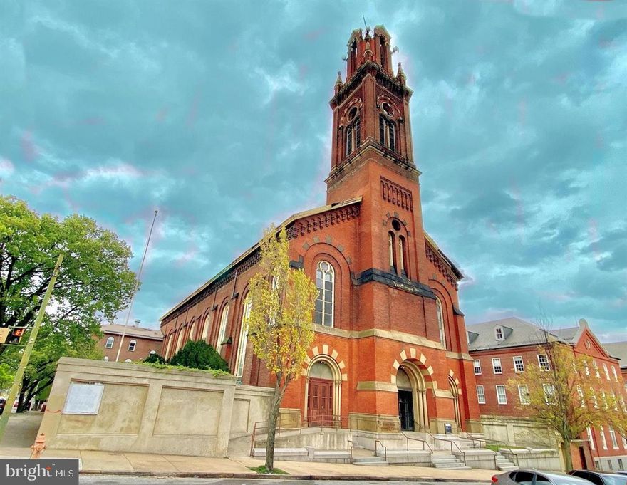 Architecturally extraordinary historic church with attached 4 story office and school rectory. 8,000+ sf Main hall with large balcony has potential capacity for over 600. Total facility is estimated at over 30,000sf. Courtyard areas on each side of main hall provide some off street parking capacity. Some original stained glass windows remain. Originally built in 1865, the sanctuary maintains much of its original detail and grandeur with some areas of the rectory having been renovated with other areas needing significant work. Full commercial kitchen on lower level and multiple kitchenettes throughout. Renovated portions of rectory building have forced air AC and gas radiator hear. Sanctuary retains much of its original glory and a baptismal pool was added. National Historic Register site as St. James the Less Roman Catholic Church designed by George A. Frederick in the High Victorian Gothic style with Romanesque Revival overtones and includes an original wine cellar, stained glass from the studios of Josef Mayer, with three large interior murals painted about 1886 by the German-born artist William Lamprecht. Potential redevelopment uses may include apartments, school, senior living, daycare, offices, boarding house, residential treatment, community commercial, etc.