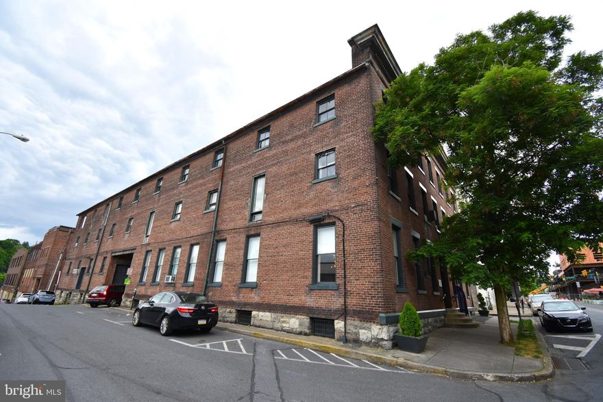 Iconic Easton arts building up for sale. Developed as a regional arts center by artist Karl Stirner, this property consists of approximately 40,000 sq ft. of mixed use space. Fabulous gallery space, artist workshops, business offices, photography studios, full fitness gym, fashion design space, and florist are a few of the tenants who occupy this amazing building. Within the building, there are two 3 bedroom residential apartments, and an efficiency apartment. The top floor penthouse apartment previously occupied by the owner is an amazing space that rivals Manhattan properties. Wide open spaces, personal galleries, views of the Delaware river and the mountains,. This is one of the most amazing apartments in Easton, and would make an exceptional owner occupant residence. The balance of that floor has been used as personal workshop and gallery space of the owner, but offers unbelievable potential for either residential or commercial space. The building has a full sprinkler system throughout, including the basement, all-floor fully serviced freight elevator, and several loading docks. Six off-street parking spaces plus the interior courtyard. City of Easton parking deck is less than one block away with dozens of fantastic local restaurants, stores, and the walking trail from downtown to College Hill named after Karl Stirner. This is an amazing property with untold potential.