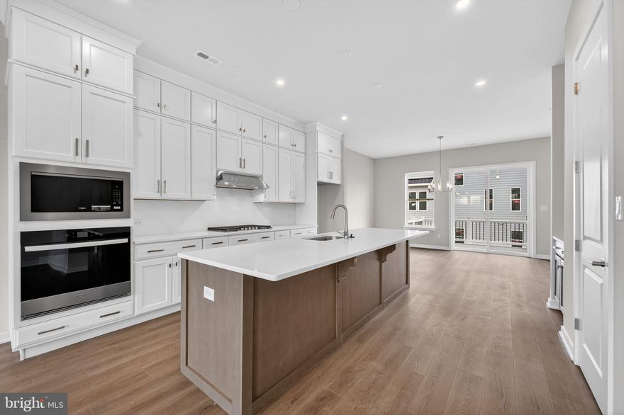 Welcome to 110 Lizabetta Lane located within King of Prussia's River Trail at Valley Forge community!

Timeless in its design and generous in its layout, this 4-bedroom, 3.5-bath  townhome offers a roomy 2-car garage and a pre-planned elevator rough-in for effortless living down the road. The entry level welcomes you with a private guest suite complete with its own full bathroom and direct access to the backyard an ideal retreat for overnight guests or a quiet space to work from home.

The main level makes an immediate impression with its soaring 10' ceilings. The dining area opens directly to an elevated composite deck, creating a natural flow for indoor-outdoor entertaining. The oversized chef’s kitchen showcases soft-closing, ceiling-height cabinetry, quartz countertops, and an island with generous breakfast bar seating.  A walk-in pantry and dedicated coffee bar add both function and luxury, while the premium appliance package includes a gas cooktop with a hood above and a built-in wall oven and microwave. The great room, lined with oversized windows facing west, is perfectly positioned to capture unforgettable sunset views each evening.

Upstairs, the primary suite is situated at the back of the home and includes a  raised ceiling, two walk-in closets and an attached bath with walk-in shower and quartz-topped dual sink vanity. Two additional bedrooms, a full hall bathroom, and laundry room complete the sleeping level of this move-in ready townhome.

Located in the vibrant River Trail at Valley Forge community with direct access to the Schuylkill River W Trail, leading straight to Valley Forge National Park ideal for outdoor enthusiasts and weekend adventurers.  This home is ready for immediate move-in or early 2026, and the community also offers homes you can personalize with move-in timelines extending through Spring/Summer 2026.