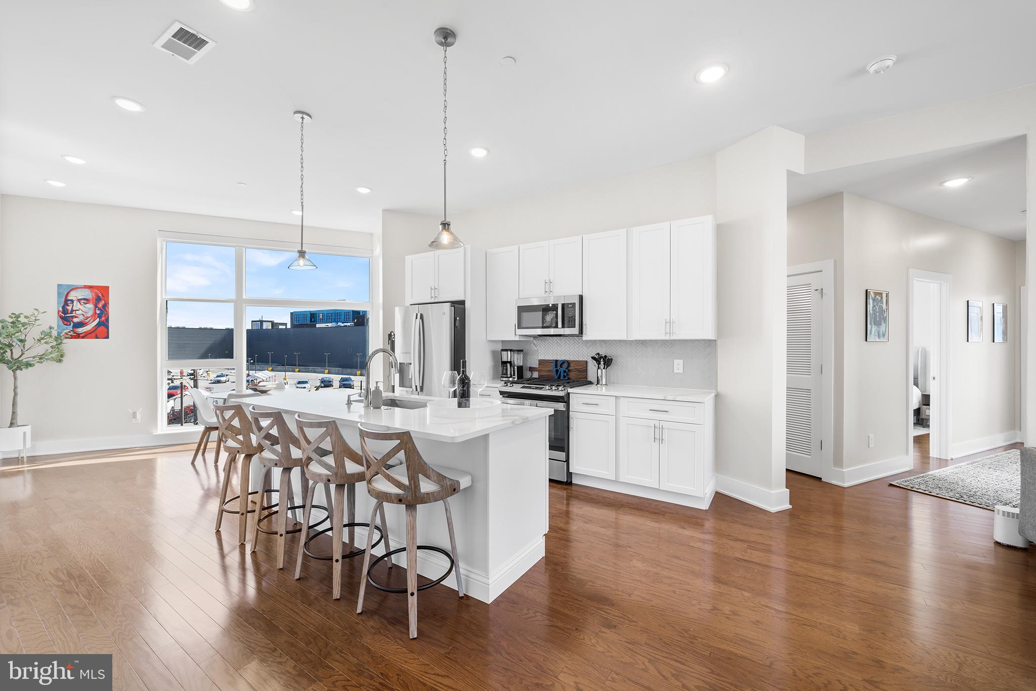 Discover an incredible opportunity to own a luxury penthouse condo unit with 1 CAR PARKING in the heart of Northern Liberties! This unit is located in the North Triangle Condo Association building located just steps from the Piazza, between N 2nd Street and Germantown Avenue and built just a few short years ago. This 3 bedroom, 2 bathroom residence spans nearly 1800 sqft and has 3 outdoor spaces including a large roof deck with city skyline views! This open floorplan is the perfect space for those that enjoy entertaining and appreciate an abundance of natural light. To enter the unit, take your PRIVATE ENTRANCE & ELEVATOR directly up to your top floor unit.. or utilize the shared entrance door for stairs access! The kitchen is the center of the main floor with the dining area off to the left and the living area off to the right. The kitchen features: white cabinets, quartz countertops, stainless steel appliances, tile backsplash and a large island! Continue down the hall where you’ll find bathroom 1 with tub/shower combo, your stackable washer/dryer closet and bedroom 1 and bedroom 2 on opposite sides. Further down the hall, is home for your primary bedroom with ensuite, a private balcony and large windows with views both east and west. Just off the living space, you’ll find the second outdoor space with stairs leading up to the massive PRIVATE roofdeck with almost 360 views of the city! Prime location that’s hard to beat—walk to the Piazza, neighborhood restaurants, shops and nightlife in NLibs and Fishtown.. and easy access to center city. What more could you ask for? A few other features to highlight: custom somfy blinds installed throughout, fitness center in the building and this unit still has a TAX ABATEMENT in place. One thing that truly sets this unit apart…. the Condo Association is Airb&B Friendly! This condo is currently used by the owner, as well as, marketed on AirB&B with solid bookings and history. Whether you’re looking for a primary residence, vacation home, or investment property, this one checks all the boxes! Don’t miss your chance to see this stunning unit for yourself! (Can be purchased fully furnished & bookings transferred to the new owner)