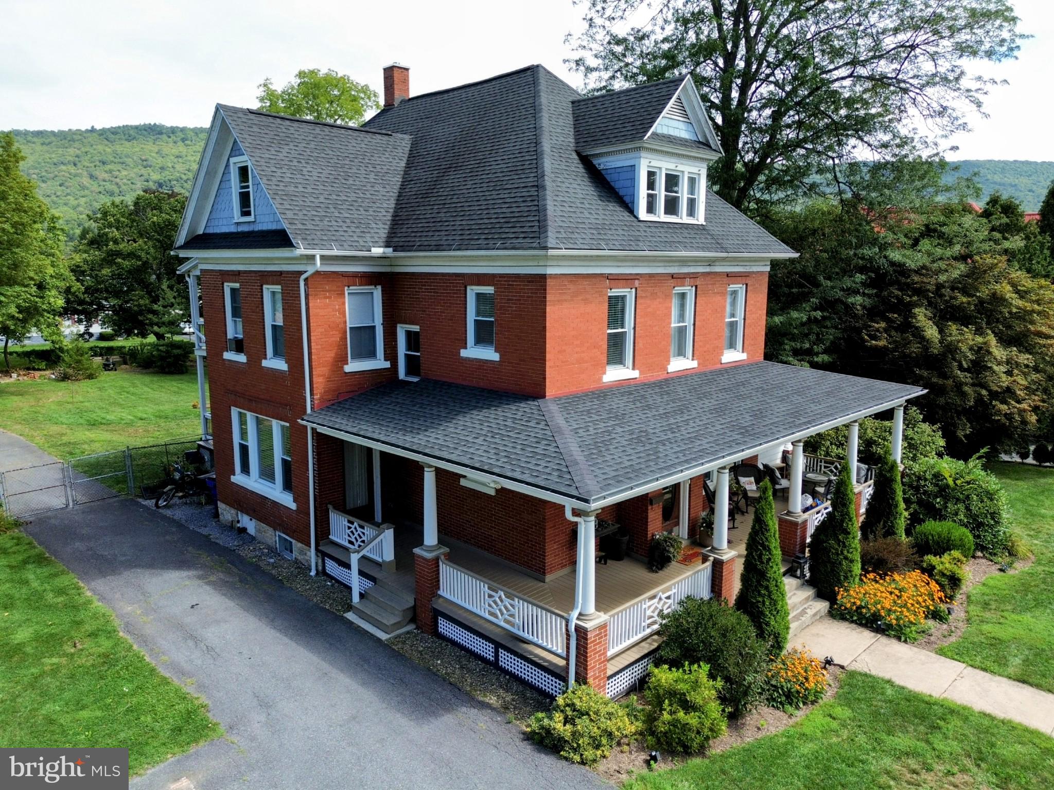 Historic charm meets modern luxury in this downtown Bedford gem!
Discover the perfect blend of timeless character and contemporary style in this beautifully remodeled 4-bedroom, 3-bath brick home in the heart of historic Bedford, PA. Much thought and detail went into the updates within this spacious and historically charming residence.
Step inside to a light-filled interior featuring a beautiful foyer with original wood details including preservation of a charming circular window and refinished hardwood floors.
Continue on to the spacious formal dining room, warm living space with fireplace, and an additional versatile room with custom bookcases. Currently used as a playroom but could easily be a first floor bedroom, office or library.
Find your way to the custom-designed kitchen with quartz countertops, premium cabinetry, and modern finishes. Some of which include an on demand hot water faucet, wine refrigerator, induction stove and pot filler. This 20ft long kitchen with island provides ample space for entertaining and everyday living.
The first-floor laundry and full bath adds convenience, while the private yard provides a serene retreat just steps from downtown's shops, dining, and community events. Also find a two car garage and covered porch/decks on front and rear.
Second floor features another full bath, three bedrooms, which includes the warm and comfortable primary suite, with your dream 13x13 walk-in closet and island! There is a 12x11 bonus space on this floor that could be a small office or reading nook.
Third floor is finished and includes flexible living spaces to ensure there's room for everyone's needs! Check out the playroom, office/bonus space, bedroom, full bath and craft room on this floor.
With generous storage, and elegant updates throughout, this property is as functional as it is stunning.
If you've been searching for a move-in ready historic home that offers both character and modern comfort, this Bedford gem is the one.
