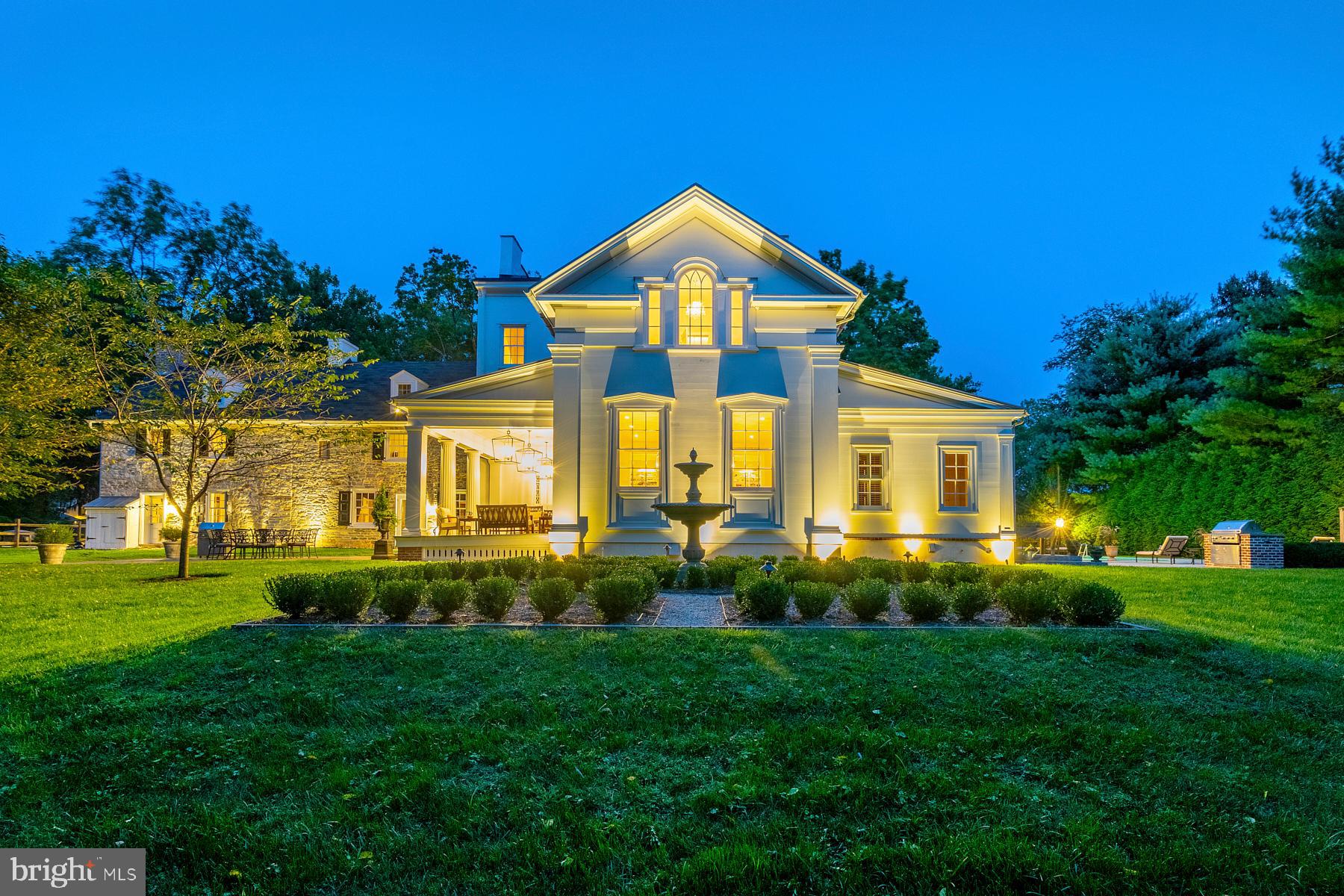 Amazing new price on this stunning and unique home. Presenting Willow Dam, an extraordinary property that has been thoughtfully expanded and updated to offer the best of both worlds to the discriminating buyer. The property includes 2 parcels, totaling over 3 acres. The house features 8 bedrooms, 5 full and 3 half baths in over 9600 square feet. Timeless features abound, including original fireplaces, hardwood floors throughout and extensive millwork. Dating back to the 1700's, the original part of the house includes a large living room and a cozy Back Den, both with fireplaces. Another section dates back to the 1800's, and features a large Dining Room with high ceilings and custom floor length mirror and a Library with fireplace and floor to ceiling bookshelves. The 2014 expansion includes a spectacular Gourmet Kitchen with custom cabinets, soapstone countertops and professional stainless steel appliances and Breakfast Area with original walk-in fireplace, a Mudroom, Powder Room, Private Office, Sunroom with flagstone floor and radiant heat, and an amazing Bar, with custom walnut paneling, cabinetry and silver sink. In addition, a fabulous old world Wine Cellar was created with stone walls, barn doors and custom tasting table. Upstairs, the addition includes a grand Walk -In Closet with island, and a Spa-Like Master Bathroom with steam shower, dual vanities and Waterworks soaking tub. The second floor includes the Master Bedroom, with fireplace, 4 additional bedrooms, 3 full bathrooms, and a half bath with laundry. The third floor offers 3 bedrooms and updated bathroom. The exterior features beautiful gardens, a lovely Covered Porch with columns, leading to Flagstone Patio for outdoor entertaining and a second large Flagstone Patio with pool, outdoor shower and built-in grill. Don't miss this once in a lifetime opportunity to own a piece of Whitemarsh history, combined with modern amenities for today's living!