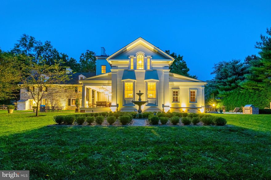 Amazing  new price on this stunning and unique home. Presenting Willow Dam, an extraordinary property that has been thoughtfully expanded and updated to offer the best of both worlds to the discriminating buyer. The property includes 2 parcels, totaling over 3 acres. The house features 8  bedrooms,  5 full  and 3 half baths in over 9600 square feet. Timeless features abound, including original fireplaces, hardwood floors throughout and extensive millwork. Dating back to the 1700's, the original part of the house includes a large living room and a cozy Back Den, both with fireplaces. Another section dates back to the 1800's, and features a large Dining Room with high ceilings and custom floor length mirror and a Library with fireplace and floor to ceiling bookshelves. The 2014 expansion includes a spectacular Gourmet Kitchen with custom cabinets, soapstone countertops and professional stainless steel appliances and Breakfast Area with original walk-in fireplace, a Mudroom, Powder Room, Private Office,  Sunroom with flagstone floor and radiant heat, and an amazing Bar, with custom walnut paneling, cabinetry and silver sink. In addition, a fabulous old world Wine Cellar was created with stone walls, barn doors and custom tasting table. Upstairs, the addition includes a grand Walk -In Closet with island, and a Spa-Like Master Bathroom with steam shower, dual vanities and Waterworks soaking tub. The second floor includes the Master Bedroom, with fireplace, 4 additional bedrooms, 3 full bathrooms, and a half bath with laundry. The third floor offers 3 bedrooms and updated bathroom. The exterior features beautiful gardens, a lovely Covered Porch with columns, leading to Flagstone Patio for outdoor entertaining and a second large Flagstone Patio with pool, outdoor shower and built-in grill. Don't miss this once in a lifetime opportunity to own a piece of Whitemarsh history, combined with modern amenities for today's living!