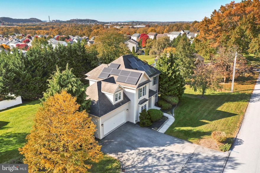 This home is a hidden gem in Mt Wolf! You wont believe the amazing view from the back of this home when you look out the windows or go onto the deck! The back yard is a stunner as well, and lots of room for activities with an oversized storage shed for your toys or lawn equipment! But that doesn't even compare to the house itself. The two story entry when coming in the front door will wow you. Not only do you have a formal dining room, but also a large eat in kitchen with a bar to boot! The fireplace is perfectly situated in the family room  to be enjoyed buy everyone in the kitchen as well with the open concept. From here you can also go onto the deck and enjoy your view. In addition to the family room, there is another living area in the front of the house open to the family room that you can make it anything your heart desires, Formal living room, office, play room, etc.. The 4 nice sized bedrooms and 2 full bathrooms are on the second floor. The primary suite has a huge bathroom with 2 sinks, shower, walk in closet and soaking tub that has the beautiful view from your home to relax and enjoy! The basement is just to top off the cake. There is another family room/bar/play room/dining room/living area/possible in laws suite that has a walk out so that you can have a sperate entry if needed. This home has everything you could need for a big family/ multi generational family/  growing family etc...