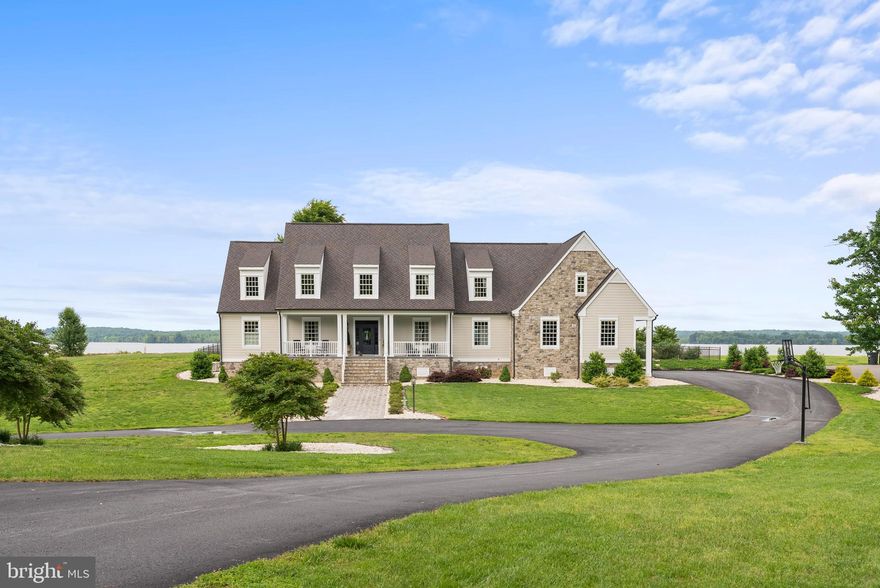 Welcome to 29481 Goose Point Ct.! CUSTOM BUILT, ELEGANT, and MILLION DOLLAR VIEWS are just a few words to describe this home. This home was custom built in 2016 and sits on 2.82 acres overlooking Portobago Bay on the Rappahannock River. The lot has a "park like" feel to it with mature landscaping and features 200' of water frontage. The exterior features a paved driveway with plenty of parking, 2.5 car attached garage, 2 bay storage shed, covered front porch, screened in rear porch, stamped concrete, pier, covered boat slip, boat lift, bulkhead protected shore line, Anderson windows/doors, 50 year shingles, irrigation, fenced in yard, generator, hardiplank and stone exterior, etc. The interior does not disappoint either. It has water views from just about every room in the house, and is full of upgrades. The first floor features a custom kitchen with all the bells and whistles, a large living room, formal dining room, an office, utility room, and a first floor primary suite with a sitting room. Upstairs features a large loft, 3 spacious bedrooms, and 2 full baths, and a full in law suite. The basement features a den area, game room, exercise room, etc. Truly a show stopper!!