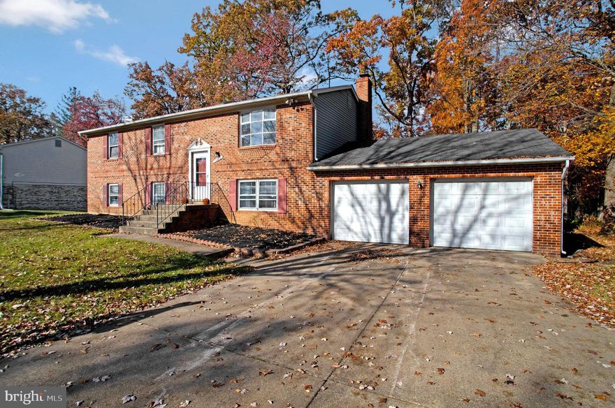 Four BR 3 bath Brick Front Split Foyer.  Full finished basement & attached 2 car garage in a fantastic Upper Marlboro location, just one turn off Route 301.   New roof over house, new deck, 2 new baths, new w/w carpeting thru-out, new water heater, new partial fencing in level backyard.   Home to be sold as is, yet should qualify for all methods of financing.  Primary BR and Bath. Table Space Kitchen w/greenhouse window. 4th Br /3rd Bath in lower level. Rec Rm w/masonry raised hearth FP, Vacant and ready for quick occupancy.