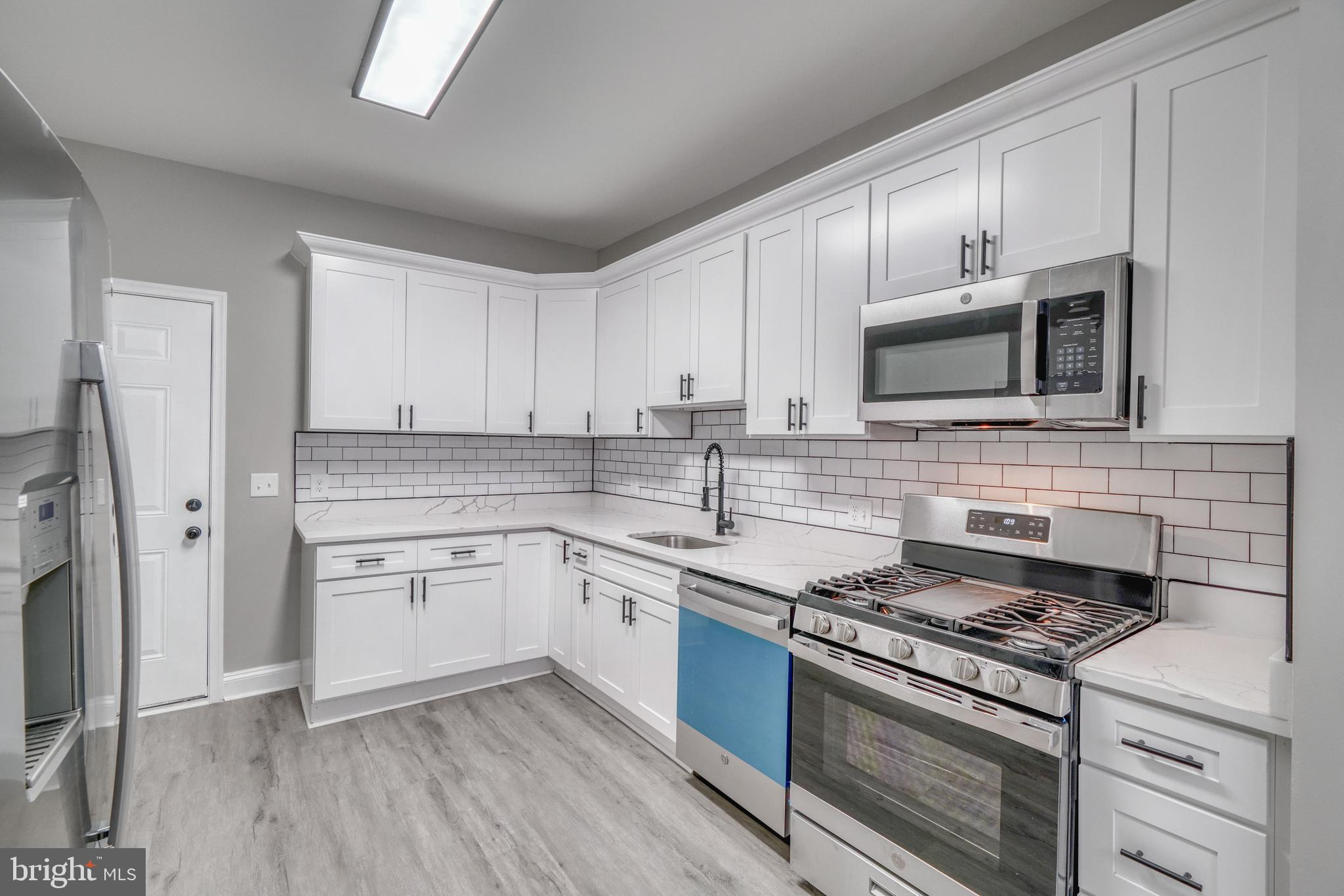 PRICE IMPROVEMENT!!!! Welcome to this newly renovated 4 bedrooms, 2.5 bathrooms townhome. The main level boasts an open floor plan with luxury vinyl plank flooring throughout the whole house. The main level offers a spacious living room, dining area and beautifully done kitchen and half bathroom. The upstairs boasts, the primary bedroom includes an en suite bath, along with two additional bedrooms and a full hall bath. The finished basement offers a fourth bedroom. This home is conveniently located close to shopping, restaurants, and has easy access to commuter routes. Additionally, enjoy the fenced in backyard. Don’t miss the chance to make this beautiful home yours!
