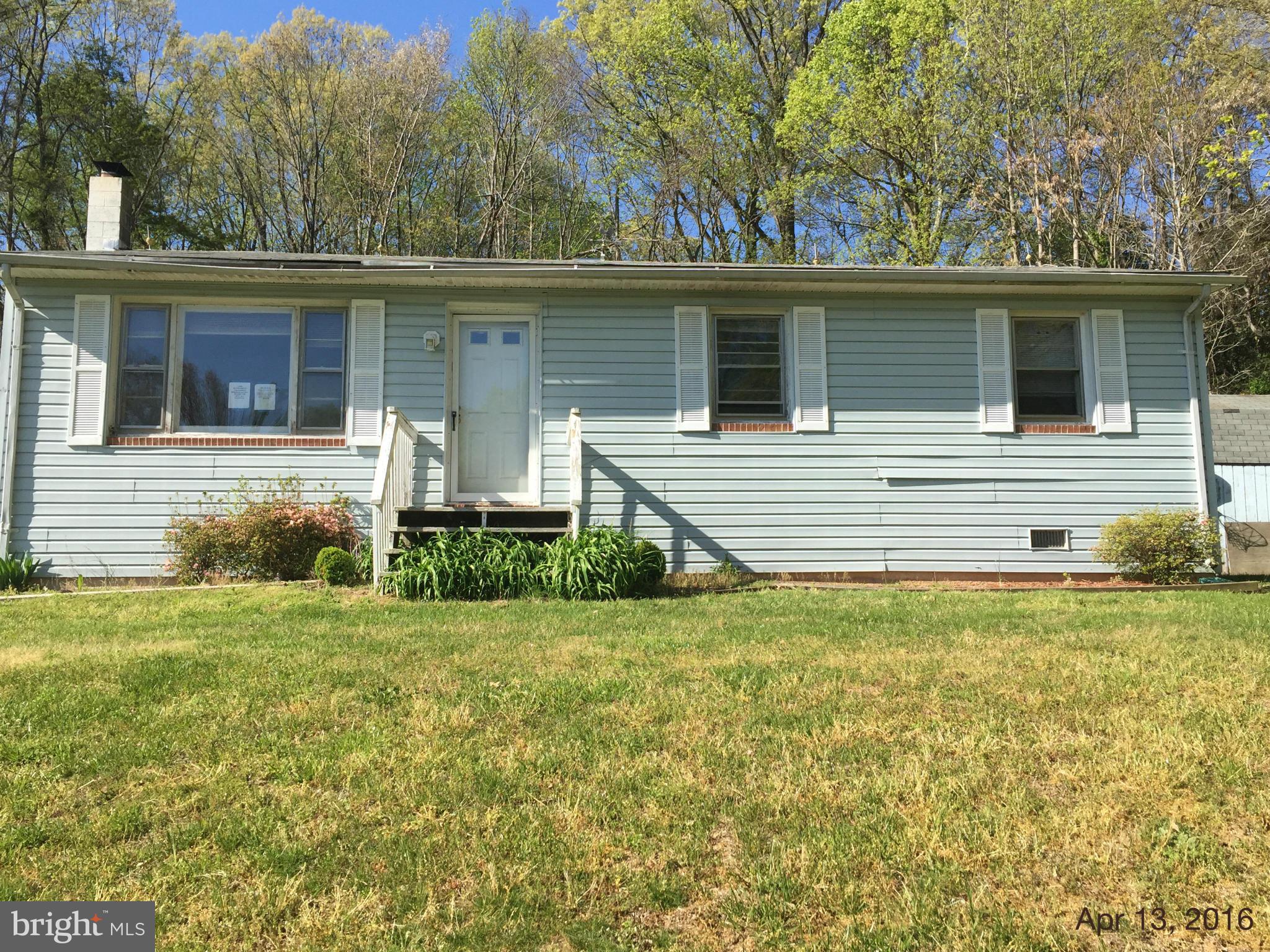 Lovely 1 level rambler in private setting. Has a cozy eat-in kitchen and family room with wood-burning stove and rear deck. Has a nice size shed in the rear with electric power. Close to both the Wicomico River and Captico Bay. Sold as-is.
