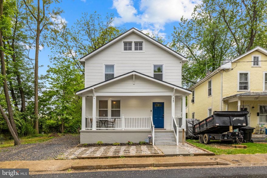 Welcome to this beautifully updated gem in the heart of Winchester! From the moment you arrive, the expansive front porch invites you to sit back and enjoy the charm of one of the city's most sought-after locations. Situated just moments from Handley High School, vibrant downtown shops, local restaurants, and scenic parks, this home offers the perfect balance of neighborhood tranquility and commuter convenience. Step inside to find a light-filled interior boasting glistening hardwood floors, crisp neutral paint, updated light fixtures, and elegant crown molding throughout. The main level features a comfortable living room and a spacious formal dining room complete with a built-in bar and custom shelving—perfect for hosting dinner parties. The chef-inspired kitchen has been modernized with sleek cabinetry, a stylish backsplash, and stainless steel appliances, while a convenient main-level laundry room and half bath add to the home's practical layout. The upper level is a private retreat, headlined by a primary suite featuring a stunningly renovated ensuite bath with double sinks and a custom-tiled walk-in shower. Two additional generously sized bedrooms and a second updated full bath provide plenty of space for family or guests. For those seeking even more flexibility, the finished lower level offers a versatile space ideal for a home gym, media room, office or play area. Outdoor living is a true highlight here; relax on the rear deck overlooking a meticulously maintained yard and a fully fenced-in backyard, where large mature trees and charming garden beds create a private, picturesque oasis. With off-street parking and every modern finish already in place, 25 W Southwerk St is ready for you to call it home.