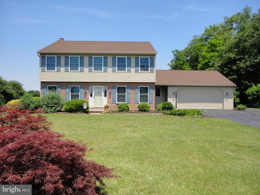 Attractive 2 story colonial just minutes to Route 41! Spacious interior features an open floor plan - updated kitchen with granite countertops, SS appliances & bay window, formal dining room, family room with wood burning fireplace, living room/office, and 1st floor laundry room! Finished basement features a large family room with Berber carpet. Relaxing screened porch in rear. Beautiful farmland views