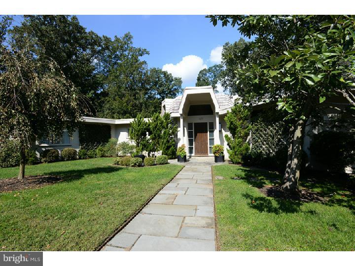 One of the area's most unique properties as featured recently by local media. This sun filled 5 Bedroom home, designed by renowned Philadelphia architect Henry Magaziner, is situated on 1.6 acres of natural beauty including mature plantings, lawns and woods. Over 5000 sq ft of living space in a honeycomb design translating into hexagonal interior and exterior spaces. Flagstone walkway leads to covered front entrance and interestingly carved front door. Tiled Vestibule with glass walls, skylight and 2 closets through door to Foyer with additional skylight. Living Room with clerestory windows, 14 ft ceilings, marble wood burning fireplace, wet bar, wall of windows and access to large deck with built in benches, grill and, stairs to lower level gardens. Formal Dining Room with built in cabinets, indirect lighting and private views from large picture windows. Eat in Kitchen with granite countertops, stainless appliances, desk area and skylight over large center island.. Adjacent Family Room with expansive skylight and French doors. Library/Den with built in cabinetry, shelving and gas fireplace with marble surround and cantilevered slate hearth. Master Bedroom includes fully mirrored Dressing Area, granite vanity with sink and marble Full Bath with whirlpool tub. Second Bedroom (currently used as sitting room/office) with Full Bath. Main Level also includes Powder Room and Laundry/Mud Room with granite countertops, cabinets and door to upgraded and oversized attached 2 car heated Garage. Patio with awning, conveniently accessed from Dining Room, Kitchen and Family Room, overlooks side yard and provides great flow for entertaining. Lower level with 3 spacious bedrooms, 2 Full Baths, large Game Room with access to lower deck, Workshop, Utility Room and several Storage areas. Additional features include automatic natural gas Generator, Lawn Sprinklers with timer, Koi Pond with waterfall and Deck, Deer Fence and a second 2 Car Garage (detached). Exceptional vistas from all rooms. Neutral palette and natural light make this property an art collector's delight and a style that lends to any type of d cor. Enjoy top rated school district with choice of LM or Harriton, easy commute to Center City by car or train and proximity to shopping and dining. Centrally located between several neighborhoods of the Main Line including Suburban Square, Gladwyne, Haverford and Bryn Mawr.