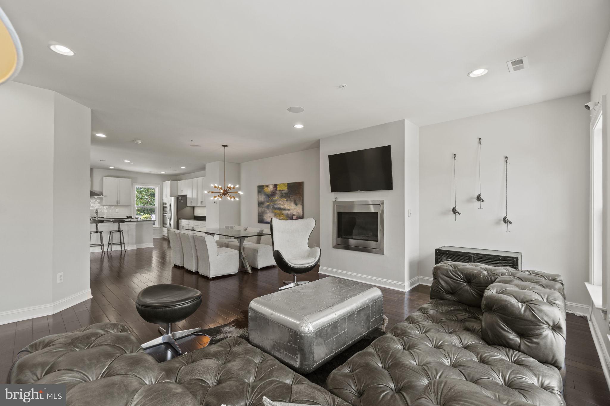 Welcome home to 11816 Mango Lane in North Potomac! Nestled in one of the most desired locations, this exquisite end unit townhome offers the perfect blend of modern luxury and convenience. Fall in love with this two-car garage, an open main floor layout, fully finished and walk out basement, this property is the epitome of contemporary living. As you step into this meticulously crafted home, you'll be greeted by a sense of warmth and sophistication. The open main floor layout seamlessly connects the living, dining, and kitchen areas, creating an inviting space for both daily living and entertaining. The gourmet kitchen boasts high-end stainless steel appliances, gas range, huge quartz countertops, pantry and a spacious island. Morning room of kitchen offers additional flex space and leads to the shaded deck. The primary bedroom is massive with tray ceiling, recessed lights and en suite bath with ceramic tiles, separate shower, soaking tub and dual vanities. Two additional bedroom, full bath and upper level laundry. The lower level is fully finished with a powder room and access to the patio. Minutes away from an array of shops, restaurants, entertainment options, parks, trails, The Kentlands/Lakelands and so much more, making it effortless to enjoy the vibrant lifestyle this area has to offer.