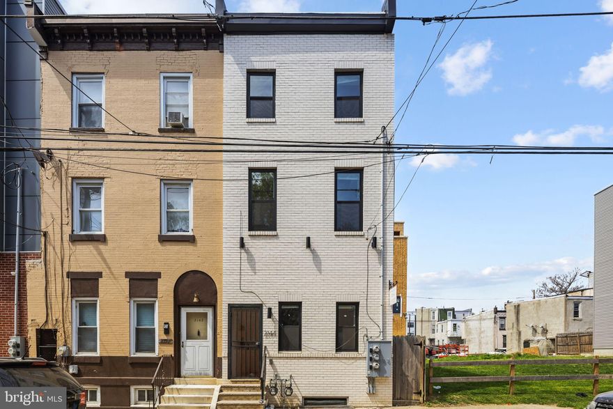 Welcome to 2144 N 8th Street — a fully gut-renovated duplex in Norris Square, offering modern finishes, strong rental income, and immediate cash flow. Completed in 2022, this property was rebuilt from the studs up with brand new electrical, plumbing (interior and exterior), roof, HVAC, and central A/C — giving the next owner true peace of mind with all major systems updated.

Both units feature bi-level layouts, 2bedrooms, 2 bathrooms,  in-unit laundry, stainless steel appliances, and brand new flooring throughout. Utilities are separately metered for each unit, keeping operating costs low and making management straightforward for investors and owner-occupants alike.

Step outside and enjoy a private rooftop deck with sweeping city views — a premium feature that sets this property apart from the competition. The large, fenced-in rear yard adds even more outdoor living space, perfect for tenants and a major draw in this market.

Located just steps from Temple University, public transit, restaurants, and shopping, this property sits in one of Philadelphia's most active rental corridors with consistent demand year-round.

Whether you're looking to house-hack, add to your portfolio, or secure a turnkey income-producing asset — 2144 N 8th Street checks every box.

Key Features:
Fully gut-renovated in 2022
New roof, electrical, plumbing, HVAC & central A/C
Stainless steel appliances in both units
In-unit laundry — both units
Separately metered utilities
Bi-level floor plan — both units
Private rooftop deck
Large fenced-in rear yard
Steps from Temple University & public transit