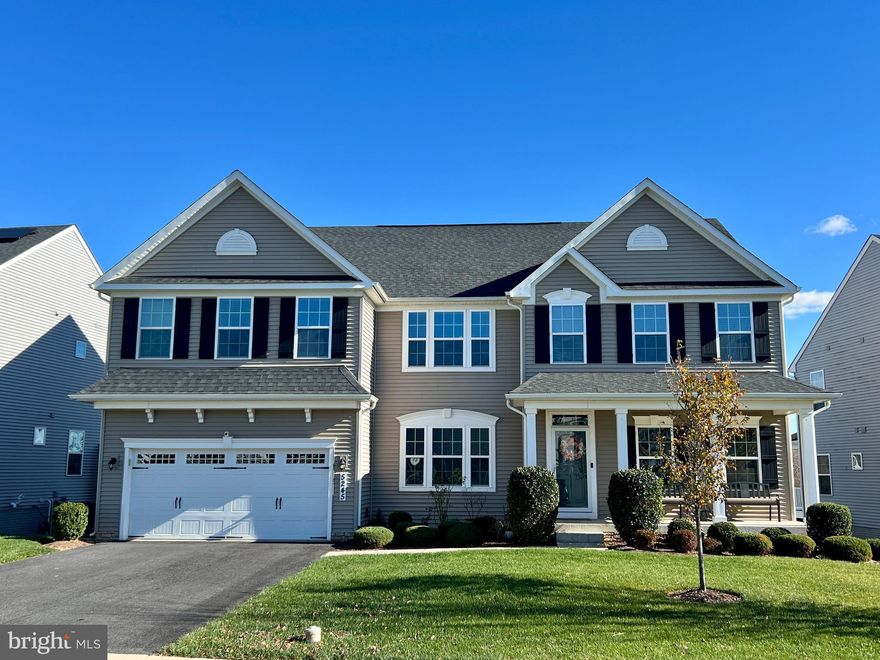 Welcome to this beautifully maintained Corsica model, one of the most desirable floor plans in the Ballenger Run community. Thoughtfully upgraded and truly move-in ready, this home offers 4 bedrooms, 4.5 baths, and three spacious, light-filled levels of living.

A charming front porch and two-story foyer set an impressive tone the moment you enter. Just off the foyer is a versatile living room—a perfect space to customize as a home office, library, or formal sitting area—along with a separate, spacious dining room ideal for gatherings. The heart of the home is the large, open-concept family room with a cozy gas fireplace, seamlessly connected to a gorgeous, chef-inspired kitchen featuring a statement island, abundant cabinetry, a walk-in pantry, and a convenient mudroom nearby.

Upstairs, you’ll find a large loft that makes a fantastic lounge, play area, or second office. The primary suite is a true retreat with two walk-in closets and a spa-like ensuite bathroom complete with a soaking tub, separate shower, and dual vanities. Three additional bedrooms—one featuring an ensuite bathroom—each include generous closet space, with a third full bathroom rounding out the upper level.

The walk-out basement provides an expansive recreation area, a full bathroom, and plenty of unfinished storage, with the option to create a fifth bedroom if desired.

Outdoor living is equally impressive. Just off the kitchen is a stunning screened-in composite deck overlooking the flat, fully fenced-in backyard that backs to open space—not another home. Enjoy peaceful mornings and relaxing evenings in privacy. Just off the screened-in deck is open deck space with stairs leading down to a paver patio, providing additional space to entertain and direct access to the walk-out basement. Bonus(!)- the property backs to green space, a walking trail, and Pike Branch creek, enhancing the serene setting.

Within close proximity to commuter highways, retail, restaurants, and charming downtown Frederick, this is a rare opportunity to own a highly sought-after Corsica model with an incredible yard, exceptional outdoor living spaces, thoughtful upgrades, and true pride of ownership throughout.