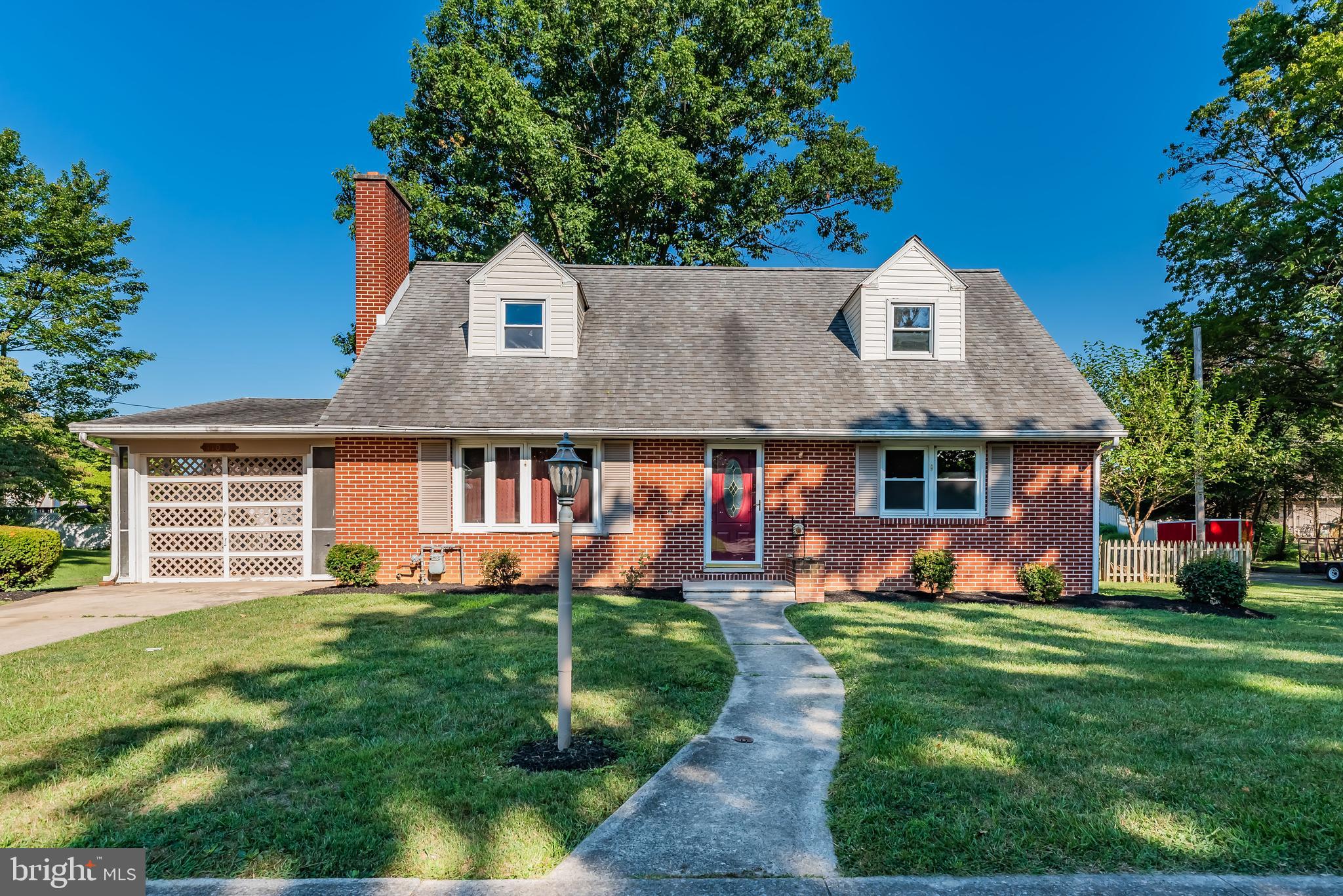 Back On Market - you can still own this charming all brick Cape Cod conveniently located within the West End of the Borough! Easy access to shops, restaurants, grocery and pharmacy. Quick commute to both Shippensburg University and Volvo Construction. Sensational, quarter of an acre homesite with great curb appeal in a beautiful neighborhood setting. Big, level backyard with outdoor storage shed, entertainer’s patio and fully enclosed by a wooden picket fence. Step inside and be greeted with gleaming original hardwood floors and white washed brick fireplace with decorative wooden mantel. Open concept kitchen/dining with ample cabinetry, peninsula island, double basin ceramic sink, new stainless steel five burner gas range and durable vinyl plank flooring. Dual bay windows allowing for an abundance of natural light. Two main level bedrooms with overhead lighting and spacious closets. Hall bath with vanity sink and walk-in shower with bench. Upstairs you’ll find two more nice sized bedrooms with tons of built-in storage and guest bath with pedestal sink and shower/tub combo. Semi-finished basement, perfect for extra living space, home gym or office. Energy efficient gas heat and hot water. New AC unit and replacement windows throughout. Barely used washer and dryer, both to convey with the sale. Single car enclosed carport. Over 2,000 finished SF, per previous appraisal. Exterior trim and front door currently getting a fresh coat of paint. Seller can accommodate a quick close. Don’t delay, this home will not last long. Call today to schedule your own private showing!