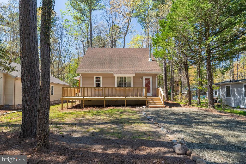 Adorable salt box home that’s full of surprises! Upon entry, the great room features wood floors, a beautiful wood ceiling, and a cozy pellet stove to keep you warm. The kitchen, laundry and bath contain hardy slate flooring, and lead into the first level bedroom with its own private sunroom! Overlook the great room from the upstairs landing. One of the 2 second level bedrooms has french door access to a private balcony. New HVAC, kitchen cabinets, granite countertop and sink in 2017. New roof, bathrooms, and stainless steel appliances in 2018. New pellet stove and water heater in 2019. New upper deck in 2023. New front deck in 2024. One Year Warranty provided to Buyer. Easy to show at an affordable price,