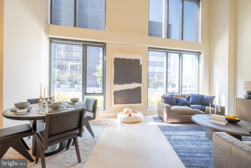 FOR A LIMITED TIME, enjoy 1 MONTH OF FREE RENT on a 13-month lease plus a $1,000 MOVE-IN CREDIT! Experience the epitome of LUXURY LIVING at 2301 JFK, Philadelphia's premier ALL-GLASS residential tower. This must see to believe MASSIVE bi-level 2-bedroom, 3-bath apartment with a loft area offers space and value. Inside each apartment, you'll find kitchens with WATERFALL ISLANDS, A BREAKFAST BAR, abundant cabinet and counter space, a marble backsplash, STAINLESS-STEEL APPLIANCES, an IN-UNIT WASHER AND DRYER, sleek HARDWOOD FLOORING, 8-foot doors, and HIGH CEILINGS that enhance the open layout. The spacious and open living and dining areas are PERFECT FOR RELAXATION AND ENTERTAINMENT. FLOOR-TO-CEILING WINDOWS come with custom solar shades. Each bedroom boasts its own LUXURIOUS marble bath, and you will just love the HARDWOOD FLOORS throughout. The loft area can easily be made into an office or another bedroom. 2301 JFK offers a ROOFTOP GYM with state-of-the-art equipment, ROOFTOP lounge with Wi-Fi, and ROOFTOP POOL, with UNMATCHED and UNRIVALED VIEWS. Complimentary bike storage, sports courts with basketball, volleyball, pickleball, squash, badminton, paddle tennis and soccer. A range of convenient services are available to support your lifestyle, such as a 24/7 FRONT DESK ATTENDANT, PACKAGE ACCEPTANCE, and on-site management. The online resident portal simplifies rent payments and work order requests for maximum convenience. 2301 JFK is PET-FRIENDLY, and boasts the largest ON-SITE DOG PARK in the city exclusively for residents. GARAGE PARKING for an additional fee. IDEALLY SITUATED BETWEEN CENTER CITY AND UNIVERSITY CITY, the location offers direct access to the Schuylkill River Trail and easy commuting. It’s less than a five-minute walk to 30th Street Station with easy access to Suburban Station. The neighborhood is rich in arts and culture, with multiple museums nearby. The Flagship GIANT™ Supermarket is just steps away. A few local dining options include Vernick Fish, Moustaki, Friday Saturday Sunday, and Borimmini. 2301 JFK is also NEAR MAJOR EMPLOYERS like the Comcast Center, Cira Centre, Aramark, and top medical institutions such as the Hospital of the University of Pennsylvania and CHOP. Students and academics will appreciate proximity to the University of Pennsylvania, Drexel University, and USciences. Green spaces such as Fairmount Park, Schuylkill River Park, Love Park, and Penn Park offer endless opportunities for outdoor enjoyment. Please note: Photos shown are of various model units. Actual finishes and layout may vary. Pricing and availability are subject to change.