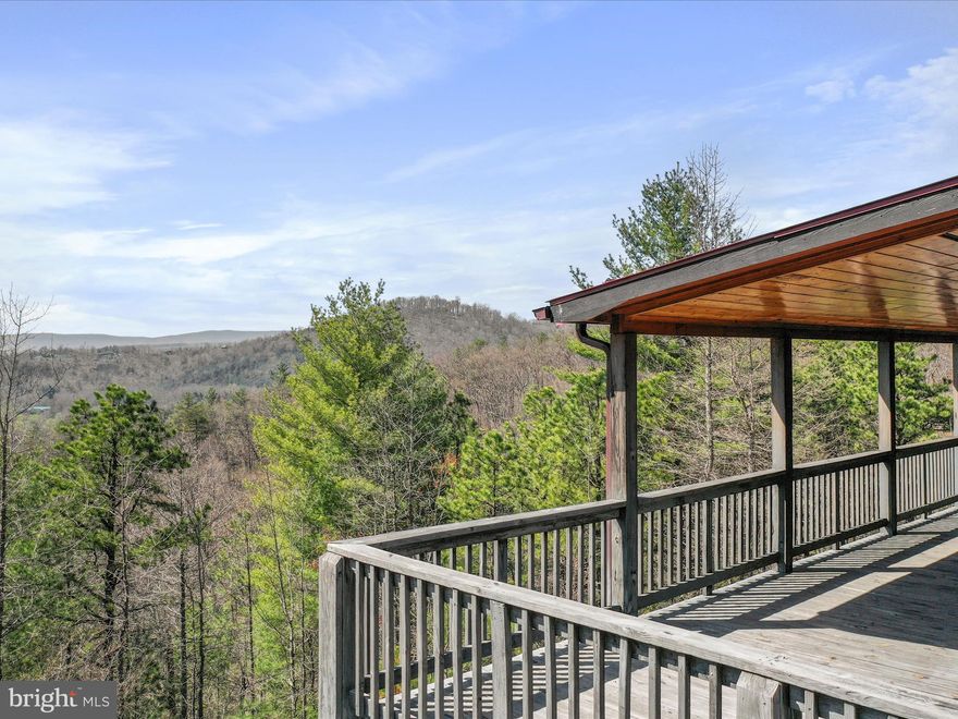 Welcome to your private sanctuary nestled in the heart of the LRV—this one-of-a-kind fully furnished property spans 10.21 acres (two lots) and borders the George Washington National Forest. Offering a perfect blend of privacy and convenience, this retreat is just a short drive from paved roads leading right to your private driveway. Enjoy breathtaking mountain views, a wraparound driveway, and a sense of tranquility without the isolation. Built in 2017 with careful attention to detail, the cabin has primarily been used as a weekend getaway, but perfect for full-time living and includes High Speed Fiber Optic Internet service for working remotely.  It features a durable metal roof, a spacious screened-in porch, and an expansive west-facing deck designed to capture the beauty of evening sunsets. Inside, you'll find granite countertops throughout and a thoughtful layout with 3 bedrooms and 3 bathrooms—each bedroom with an ensuite bath. The main level includes one bedroom, while the lower level offers two additional bedrooms. All bedrooms have direct access to the outdoors. The home is filled with an abundance of natural light, and custom characteristics.  Just minutes away from local restaurants, swimming at Trout Pond Recreational Area, and charming farmers markets, and hiking trails, this home offers the perfect balance of seclusion and easy access to nearby conveniences. Make an appointment today!