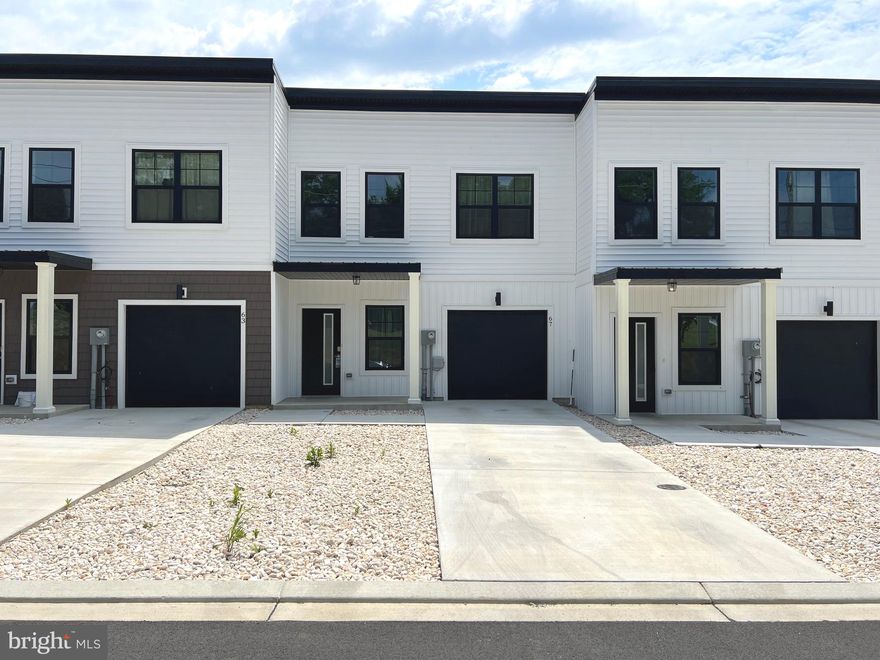 Don't have time to wait for a new home to be built, you will not want to miss this one year old home..   The very first thing you will notice is the sleek modern look that these Town Houses offer.  From the white siding to the black trim with metal roof, theses houses are sure to grab your attention.   The main level features your kitchen area, living area and a 1/2 bathroom .   Up the steps there are 3 bedrooms, 2 bathrooms, and a laundry closet with washer and dryer included..   This home features a 1 car attached garage and off street parking.   Schedule your showings today.