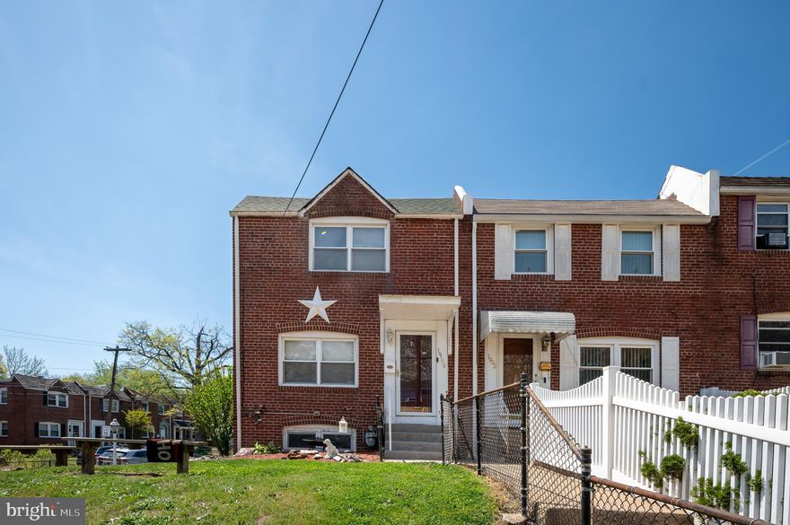 What an opportunity!  Brick end unit with large fenced yard and covered parking under spacious 16 x 16 deck.  Freshly painted - very well cared for.  Improvements: 2019-second floor bathroom, dining and living room flooring, air conditioning unit, 2020 - roof and deck ceiling, 2025 - kitchen remodel.  Currently a 1 bedroom apartment with full bath in basement.