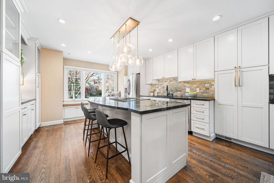 Welcome to 29 N Oakland St, a beautifully updated 3-bedroom, 3.5-bath home offering over 2,600 finished square feet across three levels and featuring more than $200,000 in upgrades throughout. The property also includes two dedicated parking spaces and a thoughtful layout designed for both comfortable living and entertaining.

The main level has been thoughtfully opened to create a bright open-concept layout with hardwood floors and crown molding throughout. A major kitchen renovation completed in 2020 introduced all-new cabinetry, countertops, lighting fixtures, refrigerator, and stove/oven, along with a large center island that anchors the kitchen. Additional highlights include a charming window seat, added cabinetry for storage, and a mini coffee bar. The kitchen flows seamlessly into the dining area and living room, where a fireplace and abundant natural light create a warm and inviting atmosphere. A renovated main-level powder room and Lutron smart lighting system throughout the main and upper levels add modern convenience.

Just off the living room, step outside to the updated rear patio completed in 2023, creating a private outdoor space perfect for relaxing or entertaining.

Upstairs, the primary suite offers a spacious retreat with custom built-ins for clothing and shoes, a bench seat with storage, and an updated closet system. The primary bathroom was fully remodeled in 2024 and features new tile, a tasteful archway detail, dual-sink vanity, and an added storage closet. Two additional generously sized bedroomsshare a fully renovated secondary bathroom completed in 2024, and all bedrooms include ceiling fans and recessed lighting.

The finished lower level offers a large flexible space ideal for a family room, media room, home gym, or guest suite, complete with new carpet (2026), built-in shelving and cabinetry, and an additional full bathroom.
Additional improvements include HVAC replacement (2019) with Ecobee smart thermostat, ProVia Endure windows and doors (2021), a newer roof (2021), updated PVC front façade, custom window treatments, newer water heater (2022), finished attic storage (2024), and new washer and dryer (2025).

Located on a quiet residential street in the heart of Ashton Heights, the home offers outstanding walkability with Virginia Square Metro and Ballston Quarter just a short walk away. Enjoy easy access to some of Arlington’s most popular spots including True Food Kitchen, Ted’s Bulletin, SER Restaurant, Punch Bowl Social, Bronson Bierhall, Ballston Local, and Aslin Beer Company, along with nearby favorites like Compass Coffee, Philz Coffee, Northside Social, VIDA Fitness, and Target.

With extensive upgrades, generous living space, two parking spaces, and a prime location close to Metro, dining, shopping, and entertainment, this home offers the perfect blend of modern comfort and urban convenience.