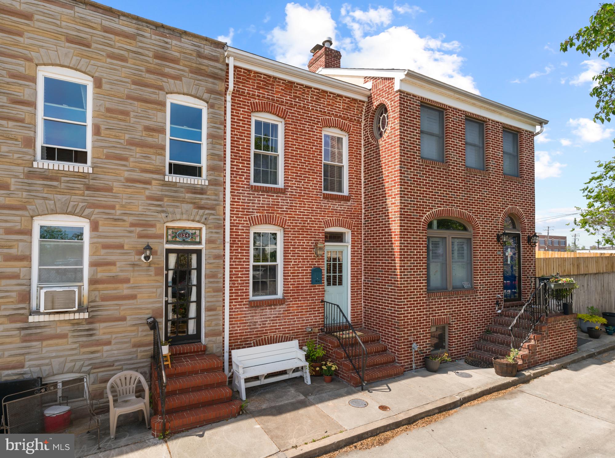 Open House Sunday, 6/1 - 11:30 AM - 1:00 PM. Who wouldn't love living in Locust Point? Just a stone's throw from a delightful variety of restaurants, shops, Fort McHenry, and the picturesque Latrobe Park, everything you need is right at your doorstep. Enjoy leisurely strolls along the peaceful promenade or hop on the water taxi for a scenic tour around the city.
The brick exterior opens to an interior filled with character and modern upgrades. The open main level showcases stunning hardwood floors, seamlessly connecting the sunlit living area with a dining space and a kitchen featuring ample cabinets, sleek stainless steel appliances, and granite countertops. At the rear, discover a full bathroom and a versatile space ideal for a bedroom or home office, with access to a private, fenced patio.
Venture upstairs via the stylish open tread staircase and soak in the natural light pouring through a skylight. The spacious front bedroom serves as a cozy retreat with exposed brick, tray ceilings, and generous closet space. Nestled between the two bedrooms is a full bathroom and additional closets for storage. The rear bedroom boasts its own balcony, with a spiral staircase leading up to a brand new rooftop deck—perfect for taking in breathtaking views of your new neighborhood.
Downstairs, the finished basement offers additional living space, complete with a laundry and utility room.
Situated at the southern tip of Baltimore, Locust Point offers the perfect mix of history, community, and fun. This home is move-in ready and waiting for you!