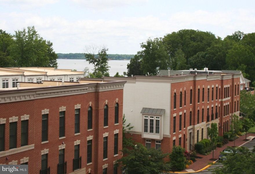 Lovely unit on fifth floor with hardwoods, new carpeting, new paint.  Water views and nice sunroom with balcony.  This is luxury condo in Belmont Bay a water community with great access to commuting options: VRE commuter train, commuter lots, direct bus service to DC and Pentagon and more.  Quiet living on the Occoquan River and only a few miles to shopping and dining.
