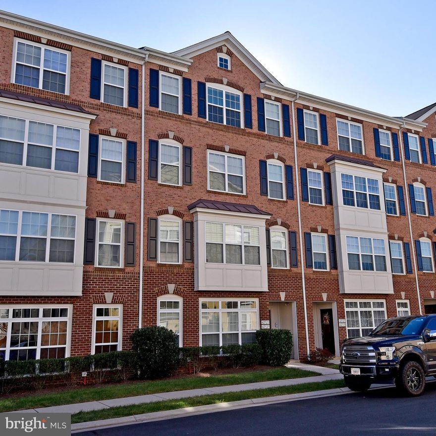 Welcome Home. Light and Bright, luxury 2-story Townhouse with one car garage in the heart of Brambleton. Designer Kitchen with cascade maple cabinets, corian base counter top with Kitchen Island and stainless steel appliances.  The large kitchen are offers pace for a table or second family room with an electric fireplace. The entire main level offers new hardwood floors, there is even an office/ den on the main level. The master bedroom is very large and features a walk-in closet with build in closet system . The master bathroom offers both a soaking tub and a shower. Laundry room is on the top level. The home is conveniently located close to shopping, dining and major commuter options. Don't miss out. Priced to sell. Will not last long.