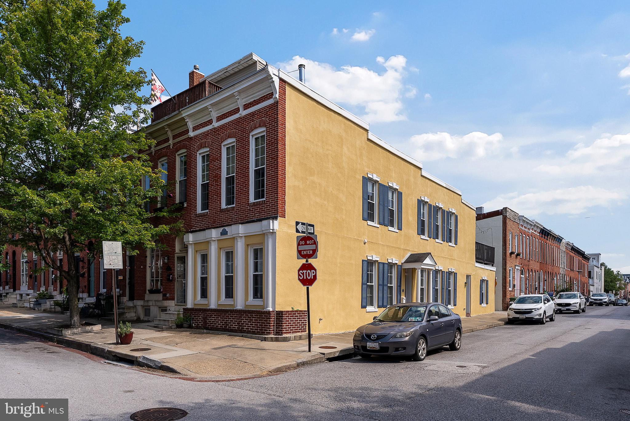 Spacious End-of-Group in Federal Hill! This bright and beautifully maintained home offers 3 large bedrooms, 2.5 bathrooms, and an impressive 15-foot-wide layout—rare for the neighborhood. The second floor features two generously sized bedrooms with plenty of closet space, including a primary suite with a private deck perfect for relaxing or entertaining. As an end unit, the home is flooded with natural light throughout the day, especially in the afternoons. The main level features soaring ceilings, a spacious living room with wood burning fireplace, and a kitchen with table space for dining. There's also a versatile bonus room that can serve as a 3rd bedroom, home office, or additional living area, plus a powder room and conveniently located laundry room with side-by-side washer and dryer. A brand-new HVAC system was installed in 2025, offering peace of mind and energy efficiency. This beautiful home is on a quiet block with easy access to all the best of Federal Hill—parks, restaurants, shops, and more—this one checks all the boxes for space, location, and charm.