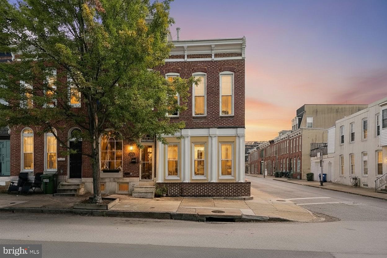 Spacious End-of-Group in Federal Hill! This bright and beautifully maintained home offers 3 large bedrooms, 2.5 bathrooms, and an impressive 15-foot-wide layout—rare for the neighborhood. The second floor features two generously sized bedrooms with plenty of closet space, including a primary suite with a private deck perfect for relaxing or entertaining. As an end unit, the home is flooded with natural light throughout the day, especially in the afternoons. The main level features soaring ceilings, a spacious living room with wood burning fireplace, and a kitchen with table space for dining. There's also a versatile bonus room that can serve as a 3rd bedroom, home office, or additional living area, plus a powder room and conveniently located laundry room with side-by-side washer and dryer. A brand-new HVAC system was installed in 2025, offering peace of mind and energy efficiency. This beautiful home is on a quiet block with easy access to all the best of Federal Hill—parks, restaurants, shops, and more—this one checks all the boxes for space, location, and charm.