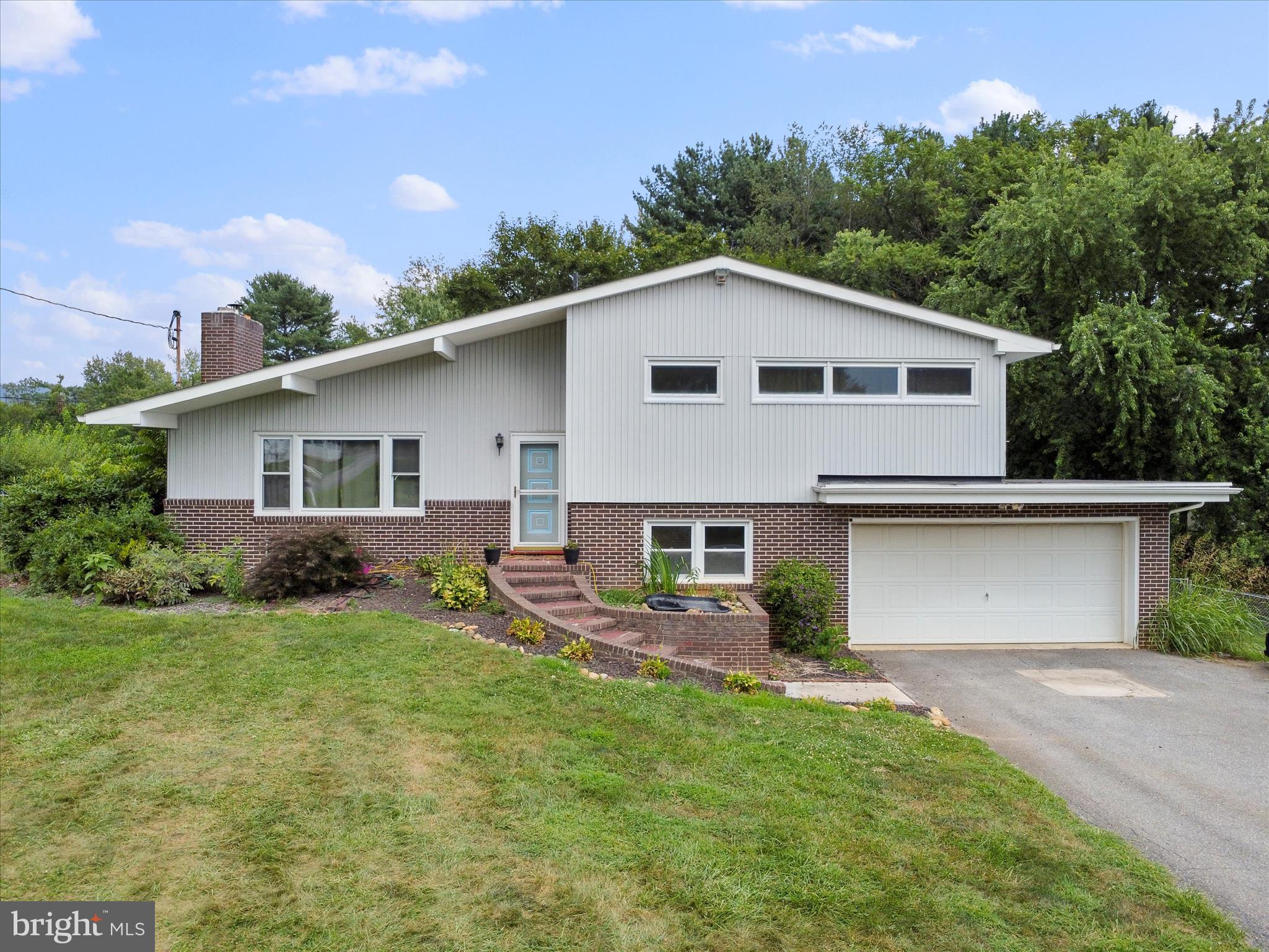 Rare find! Spacious 3 bedroom/2 full bathroom split level on almost half an acre located in beautiful Smithsburg, MD. Main level includes a tastefully updated kitchen, separate dining room, and living room with wood burning fireplace. Dining room walks out to a private back yard that is fully fenced and backs to trees. Upper level features hard wood floors, three spacious bedrooms, and a full bathroom with tub/shower combination. Lower level has a family room, full bathroom with stand up shower, laundry room that includes washer and dryer, and a huge, unfinished bonus area for plenty of storage. Central air conditioning. Oil heat with electric baseboard as back up. Oversized two car attached garage. Extra wide driveway to accommodate up to six additional vehicles. No city taxes and no HOA. Enjoy the close proximity to Cunningham Falls, Fort Ritchie, and wineries. Within a few short miles to I-70 and I-81 for easy commuting. Don't miss your opportunity. Schedule your showing today!