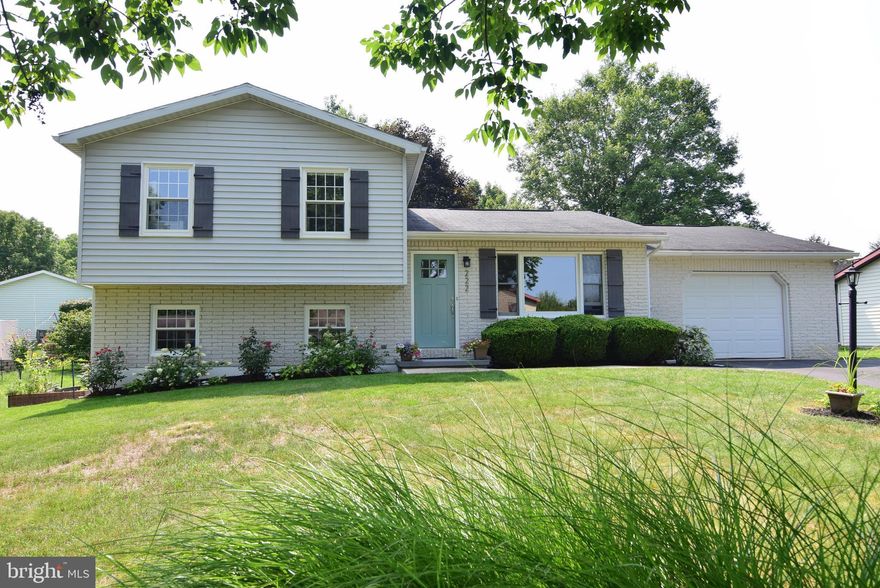 Located in the desirable Houserville neighborhood with close proximity to the Spring Creek elementary school and only 4.5 miles to Penn State University, this charming split-level, 3 bed , 1.5 bath home offers a perfect blend of modern updates and cozy comfort.  As you step inside, you'll notice the fresh, inviting feel throughout the home, thanks to recent updates that include new doors, new windows, new lighting fixtures, new baseboard heaters and fresh paint.  In the kitchen, you'll find new countertops complemented by a tasteful tile backsplash. One of the highlights of the kitchen is the extra-large anthracite farm sink, a practical yet stylish addition.   New stainless-steel appliances and a butcher block island with space for three bar stools and a breakfast nook with a shiplap accent wall add charm to the kitchen.  From the kitchen, step through the sliding doors and you'll find a lovely 11 x 17 covered back deck, perfect for entertaining or simply enjoying the outdoors. The flat yard offers plenty of space for outdoor activities. Whether you're hosting a barbecue or just relaxing with a book, this outdoor area is sure to become a favorite spot.  The upper level of this home features three bedrooms and a newly remodeled bathroom, with modern fixtures and a stylish tub/shower combo.  The lower level offers more living space with a spacious 25’ x14’ room that can be customized to your liking as a cozy family room, a home office, or a play area.  It features durable laminate flooring, a convenient remodeled half-bath and laundry room.   If you want supplemental heat in the winter, fire up the Harmon coal stove, to add some warmth to the space.  With its walkout access to the backyard, the family room extends your living space outdoors.  The home is also radon mitigated.  The driveway offers space for up to three additional vehicles besides the 1-car garage with shelves for storage.  The back of the garage has been divided into a small workshop area and an 8 x 8 storage area with a door leading out to the back yard.  The easily accessible large attic space above the living room as well as the 12’x 10’ shed in the backyard also provide additional storage space.  The home has been tastefully updated and is move-in ready!