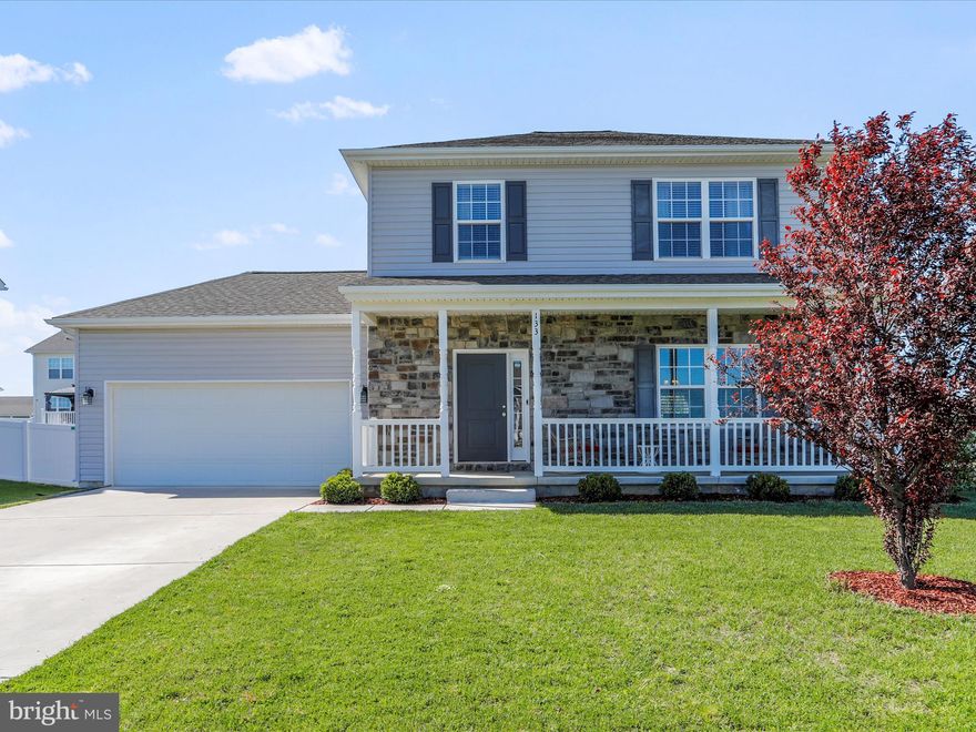 This home is nearly new, priced to sell, and move in ready.  You will appreciate the corner lot and fenced rear yard. Home features three large bedrooms, two full baths, and a half bath on the main level. Heritage Hills is located centrally in Berkeley County with easy access to Charles Town, Leesburg, Winchester, Hagerstown.  Quality construction evident in this open floor plan Colonial with hardwood floors and 9' ceilings.  Kitchen is a stunner with granite counter tops, 42" cabinets, and stainless steel appliances - plus! a center island.  The primary suite has beautiful ceramic tile shower and large walk-in closet.  Full front porch on this lovely home has great curb appeal.  Two car garage with openers.  Don't miss it!