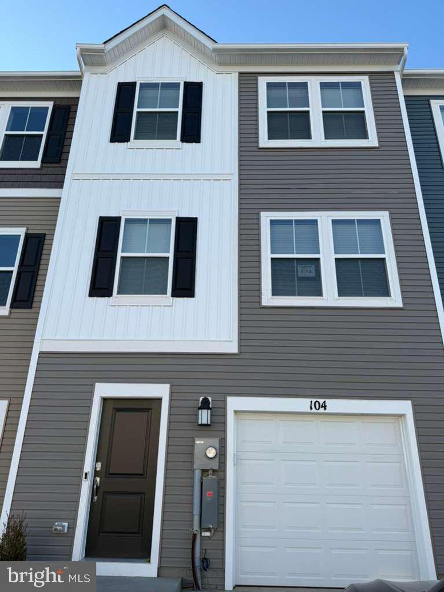 Welcome to The Gallery, one of Martinsburg's newest communities! Conveniently located near shopping, dining, recreation, and just minutes from I-81, this home offers both comfort and accessibility.

Step inside this beautifully designed three-level townhome. The entry level features a spacious recreation room that can be used as a home office, media room, or additional living space, along with access to the one-car front-load garage and backyard.

Upstairs, the main level offers an open-concept layout connecting the kitchen, dining area, and great room perfect for everyday living and entertaining. The kitchen is equipped with stainless steel appliances and ample cabinet space, and a convenient half bath is also located on this level.

The upper floor is dedicated to comfort and privacy, featuring three well-sized bedrooms and two full bathrooms. The primary suite offers a spacious layout with a private en-suite bath and ample closet space. The additional two bedrooms are ideal for family members, guests, or a home office setup and share a full hallway bathroom. This level provides a functional and comfortable retreat at the end of the day.

Homes in this desirable community rent quickly submit your application today and secure this beautiful home before it's gone!