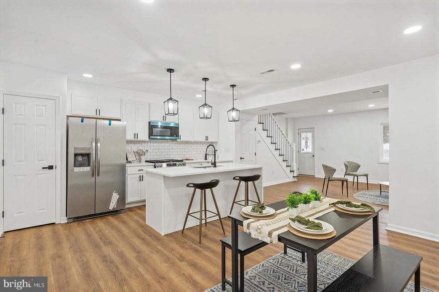 Newly remodeled 4BR/2BA brick Townhome located on a quiet street in the neighborhood of Berea.   Make your way to the covered front porch, and open the door into your new home.  Step into a stunning main floor boasting an open floor plan, tons of natural light, luxury flooring, and recessed lighting.  This floor offers a large living room, spacious dining room, and stunning kitchen.  The kitchen features plenty of cabinets, a separate pantry closet,  brand new stainless steel appliance including a slide-in gas range, quartz countertops with a subway tiled backsplash, and a deep stainless sink set into an island with pendant lighting and breakfast seating for two or more.  On the second floor is a large primary sized bedroom, two sizable secondary bedrooms, and a beautifully remodeled full bath with a vessel sink vanity.  The lower level features additional living space which includes the fourth bedroom, a full bath with a vessel sink vanity, a laundry closet, a spacious family room, storage, and a walk-out to the fenced yard.  From the kitchen step outside to a covered dual purpose patio/parking pad ideal for parking at least two cars, or for entertaining family and friends.  This home is move-in ready with so much to offer new homeowners, and is located in close proximity to shopping, restaurants, and commuter routes.