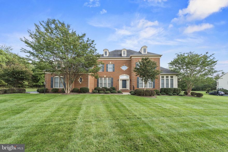 Welcome home to this beautiful estate home well situated on 3 manicured acres with public water and sewer in Loudoun County*This gorgeous property offers a brick exterior with keystone accents, mature landscaping with up lighting, a 14-zone underground irrigation system, 3-car Side Load Garage, 14 kw Generator and a custom patio to the rear with a built-in gas grill, and covered stone fireplace*The original owners have taken excellent care of this property and have recently installed new carpet throughout the upper level of the home as well as replaced two of the four HVAC units in the home*The home features large window with transoms on top and blinds throughout*You will see an extensive trim package throughout offering 3-piece Crown Molding, Chair Rail, Box Trim and Floor Molding as well as Wood Cased door openings and Windows*You are greeted by the 2-story Foyer with hardwood flooring, a Half Bath, coat closet and an extra storage closet under the stairs*Formal Dining Room has a chandelier, two sconces and access to the Butler's Pantry which features 42" cabinets, backsplash and recessed lighting*The Formal Living Room off the Foyer leads into the Sunroom extension which has hardwood flooring, recessed lighting and access to the Office, you can also access the Office from French Doors off the Foyer*Oversized, gourmet, Kitchen offers a large island with a breakfast bar as well as ample cabinetry, double wall oven, gas cooktop, built-in microwave, dishwasher, an updated French Door refrigerator, granite counters, recessed lighting, breakfast nook and access to a second Sunroom extension with a second breakfast bar*Sunroom offers ceramic tile flooring, lots of rear facing windows and a patio door to the outdoor living space*Off the Kitchen is the Family Room offering a gas fireplace, ceiling fan with light, carpet and windows to the rear and side*The main level also features a Mud Room that opens to an enormous Laundry Room with a second Half Bath*Access to the Upper Level can be had by the front or the rear Staircase*French Doors open to the Primary Suite which offers a Sitting Room, 3-sided Fireplace and access to the covered Veranda*Primary Bathroom is fully equipped with separate Vanities, jetted soak tub, oversized shower with two entrances and two shower heads, two, separate, enclosed commodes and an large Walk-in Closet*All four of the Guest Bedrooms offer large closets, ceiling fans with lights and En-Suite Bathrooms*Fully finished Lower Level boasts an open Rec Room with a 2-sided gas Fireplace, Wet Bar with 42" cabinets, tile flooring, beverage cooler, dishwasher, built-in microwave, backsplash, pendant lighting & recessed lighting*Also on the Lower Level is a Full Bathroom as well as the 6th Bedroom with a Walk-in Closet, ceiling fan with light and carpet*There is already a Media Room built out for you to enjoy - the screen, projector and furniture will convey*A flex space is also finished and is currently used as a gym, this room has access to a Storage Room*