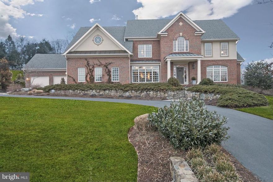 Exceptional young colo on 1 ac w/loads of custom details,high ceilings, terrific rm sizes, a great circular flr plan AND a 4 car gar!!  Beautiful interior finishes incl custom library built-ins, coffered ceiling FR w/stone FP, gas FP in LR, spacious Mstr Suite w/sitting rm & big bath.  Wonderful kitchen w/huge tblspc, ctr island & tons of storage space.  Huge daylight w/o lwr lvl! Picture Perfect